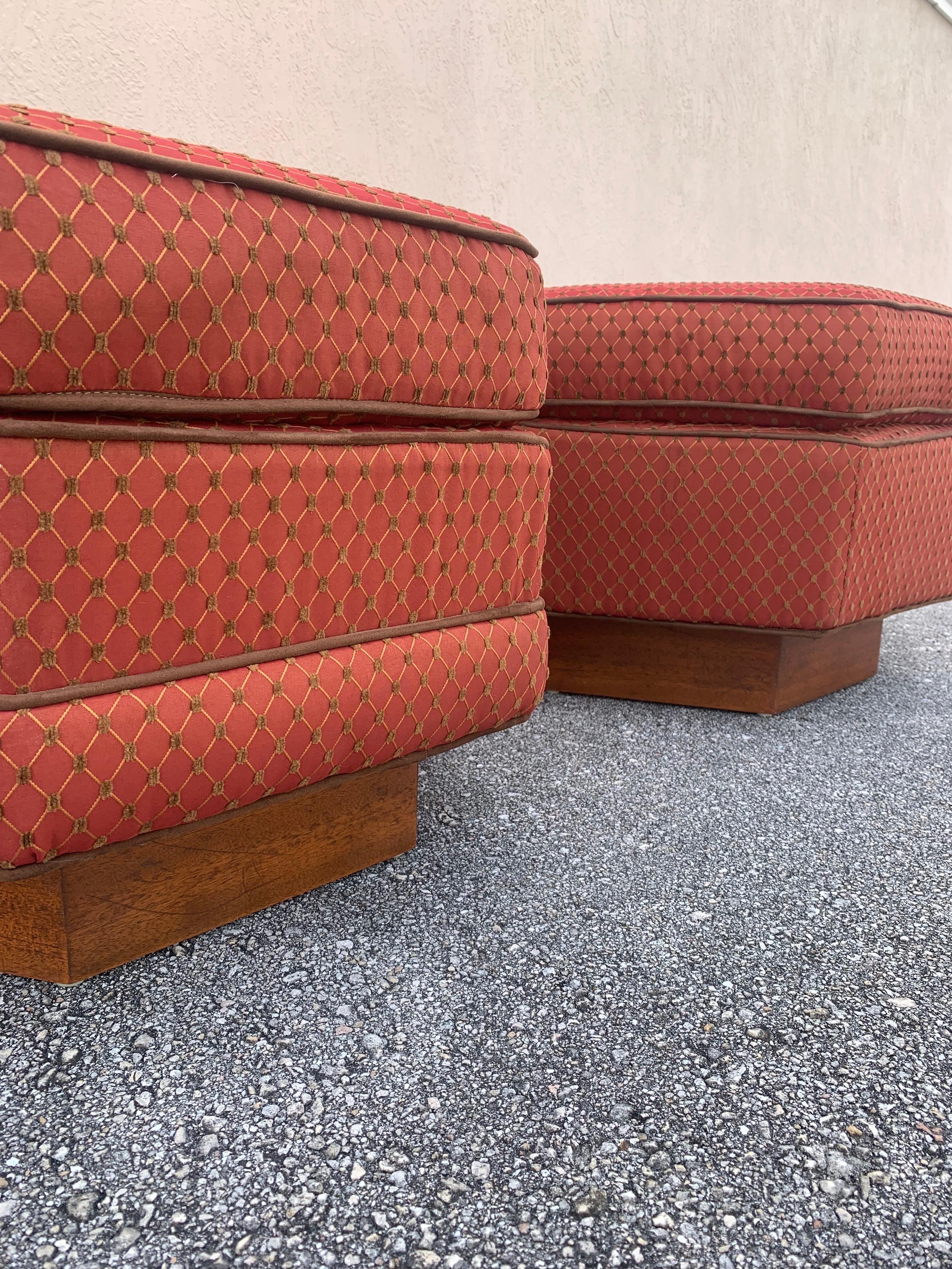 A pair of Mid Century Modern ottomans. 

These ottomans were custom made for a house in New Jersey that was designed by a student of Frank Lloyd Wright that was recently featured in an episode of the Marvelous Mrs Maisel. Owners were adamant that