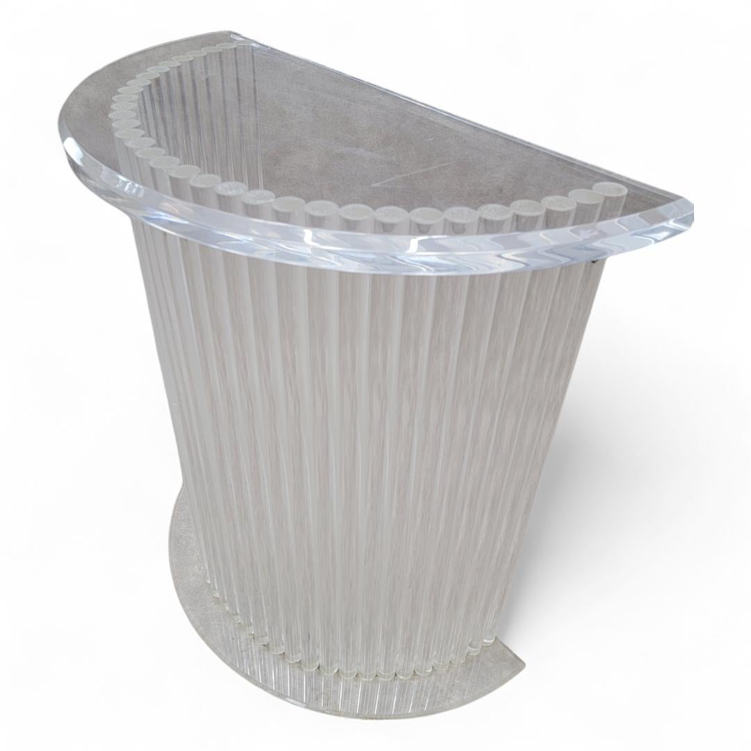 Mid Century Modern Custom Lucite Cylinder Demilune Pedestal/Console

The Mid Century Modern Custom Lucite Cylinder Demilune Pedestal/Console is a striking piece that seamlessly blends elegance with contemporary design. Its transparent construction