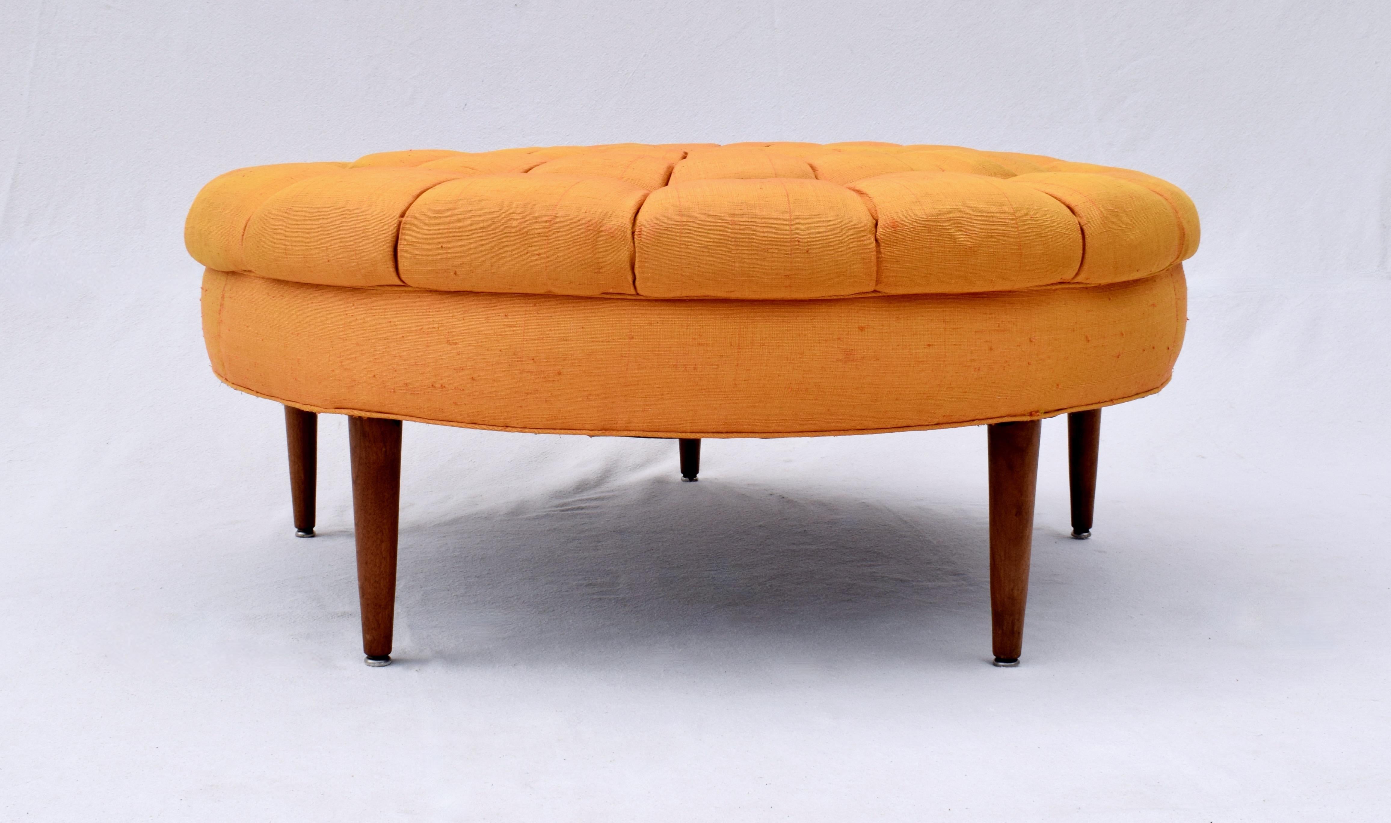 An unusual custom Mid-Century Modern tufted ottoman in vibrant Sunflower raw silk upholstery with Walnut tapered legs. Fully reinforced with new webbing from the underside to maintain the integrity of the outstanding tufts & seat; otherwise all