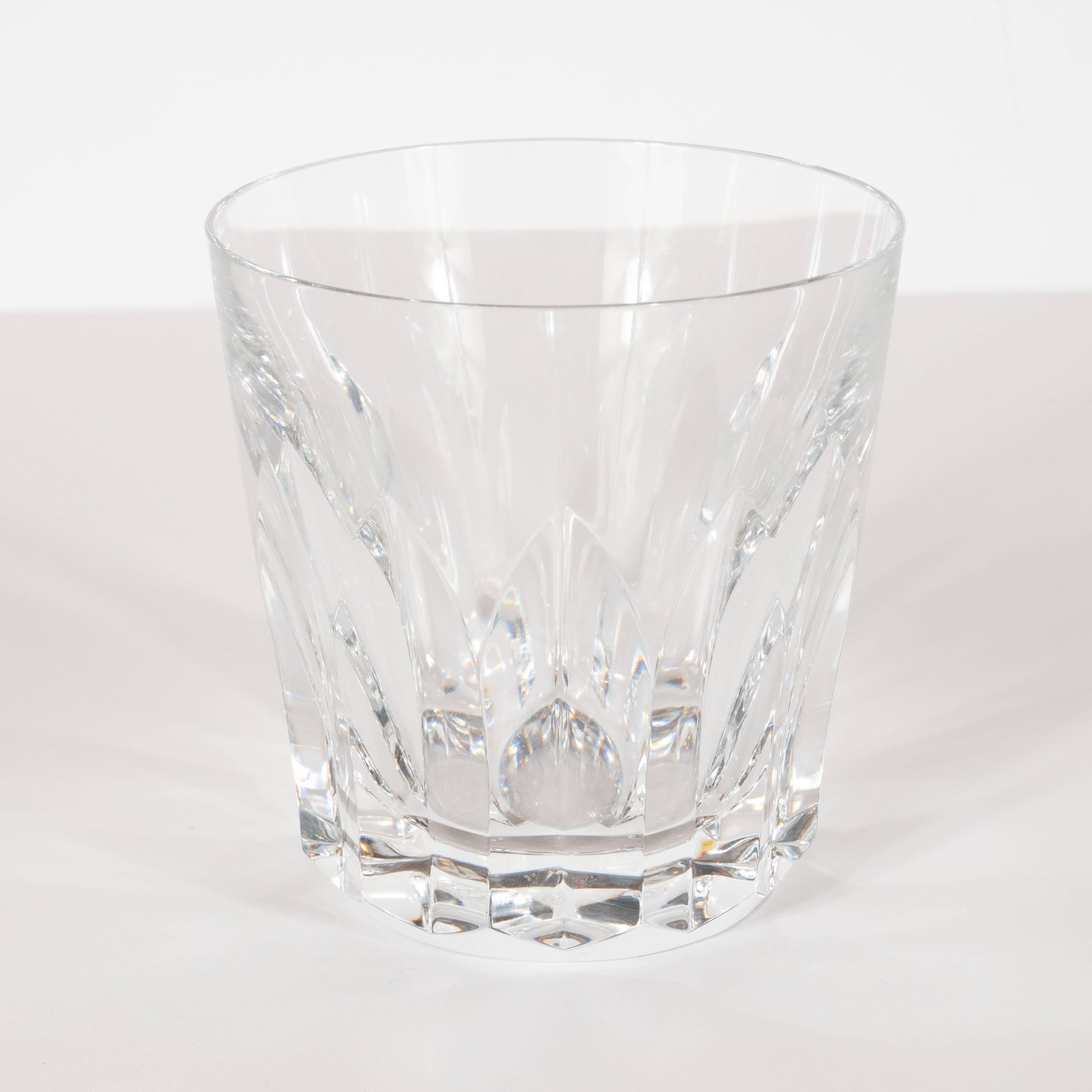 This gorgeous set of six lowball/ tumbler glasses were realized by Baccarat, circa 1970- one of the most esteemed makers of crystal, since 1764 (originally the supplier to King Louis XV). Offering Baccarat's iconic 