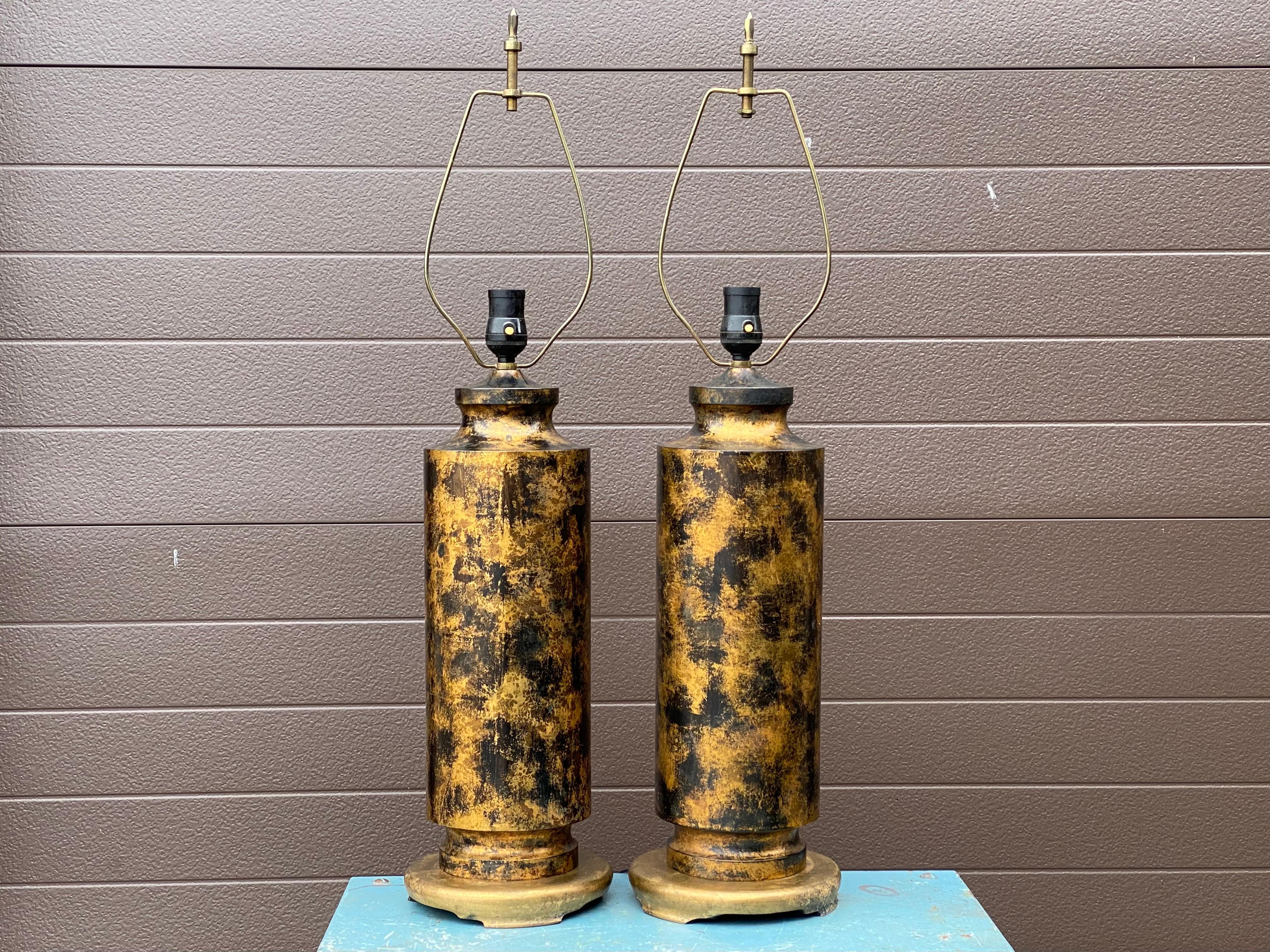 Pair of metal table lamps on wood bases with distinctly modern bronze patchwork patination after James Mont circa 1940s to 1950s