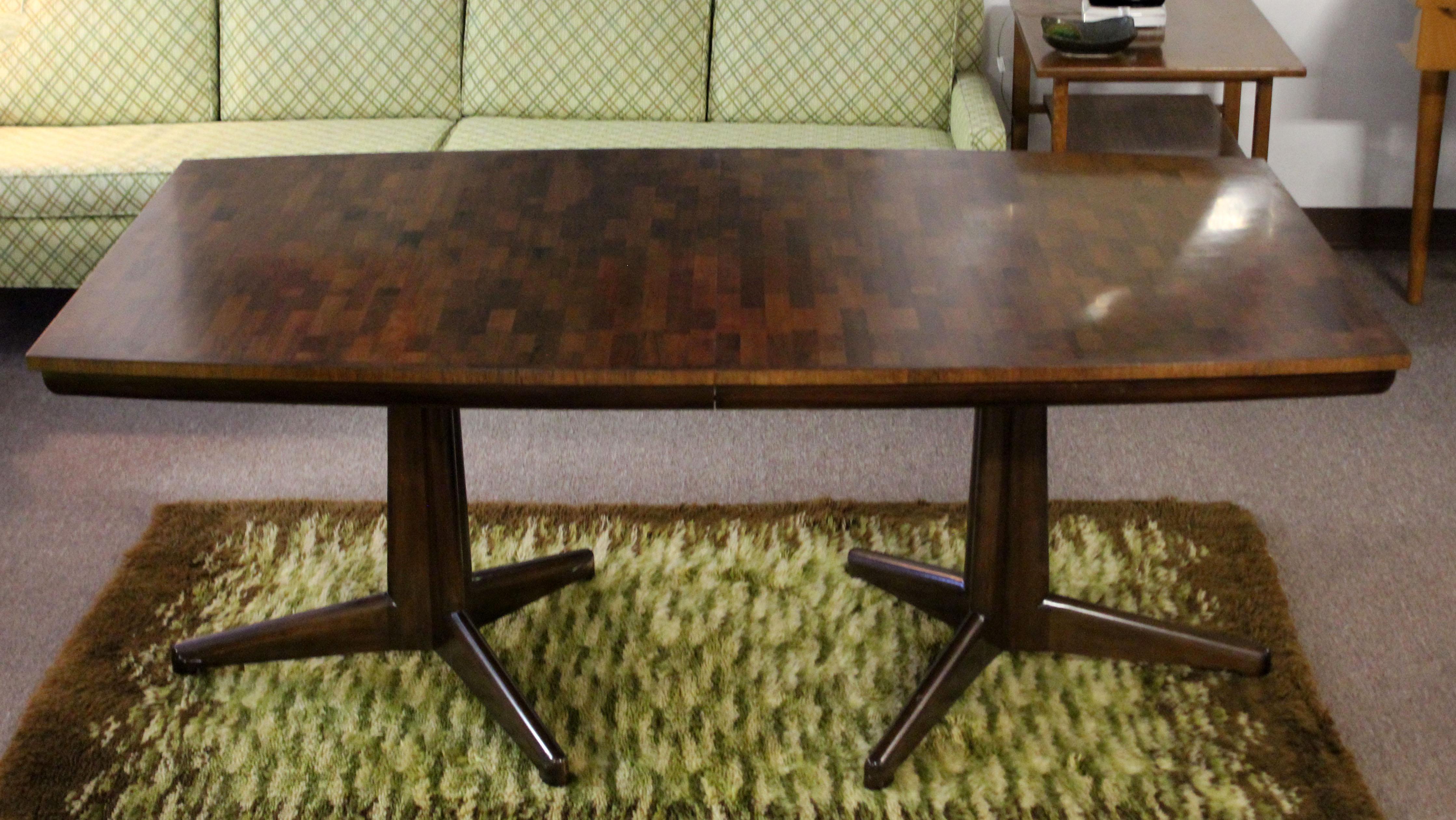 For your consideration is an incredible, parquet wood, expandable dining table, with three leaves, by Dale Ford for Widdicomb, circa the 1970s. In excellent condition. The dimensions closed are 72
