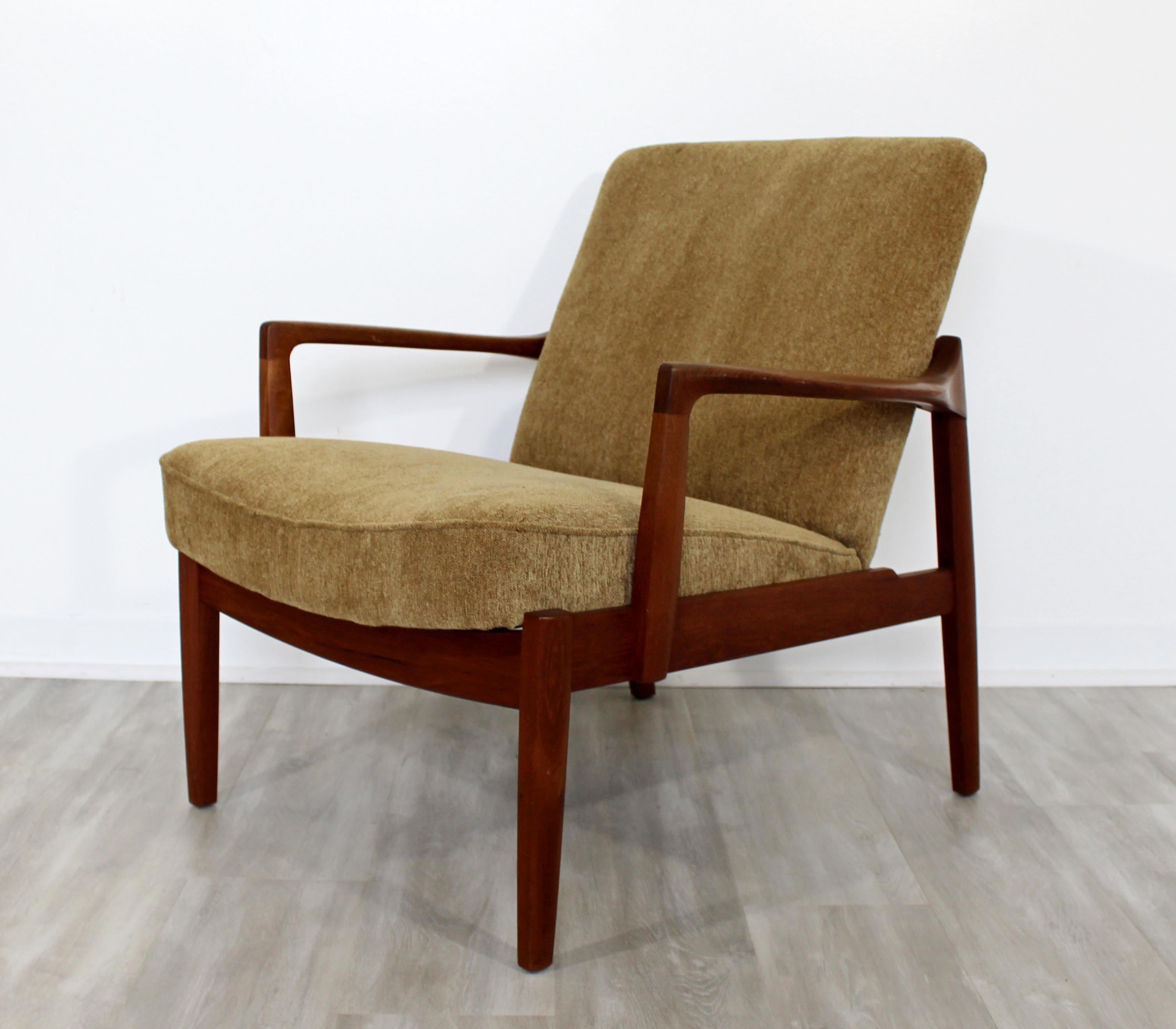 For your consideration is an incredible, Danish teak armchair, 135 teak lounge chair by Tove & Edvard Kindt-Larsen for France & Søn, circa 1950s. In excellent condition. The cushions have recently been professionally reupholstered. The dimensions