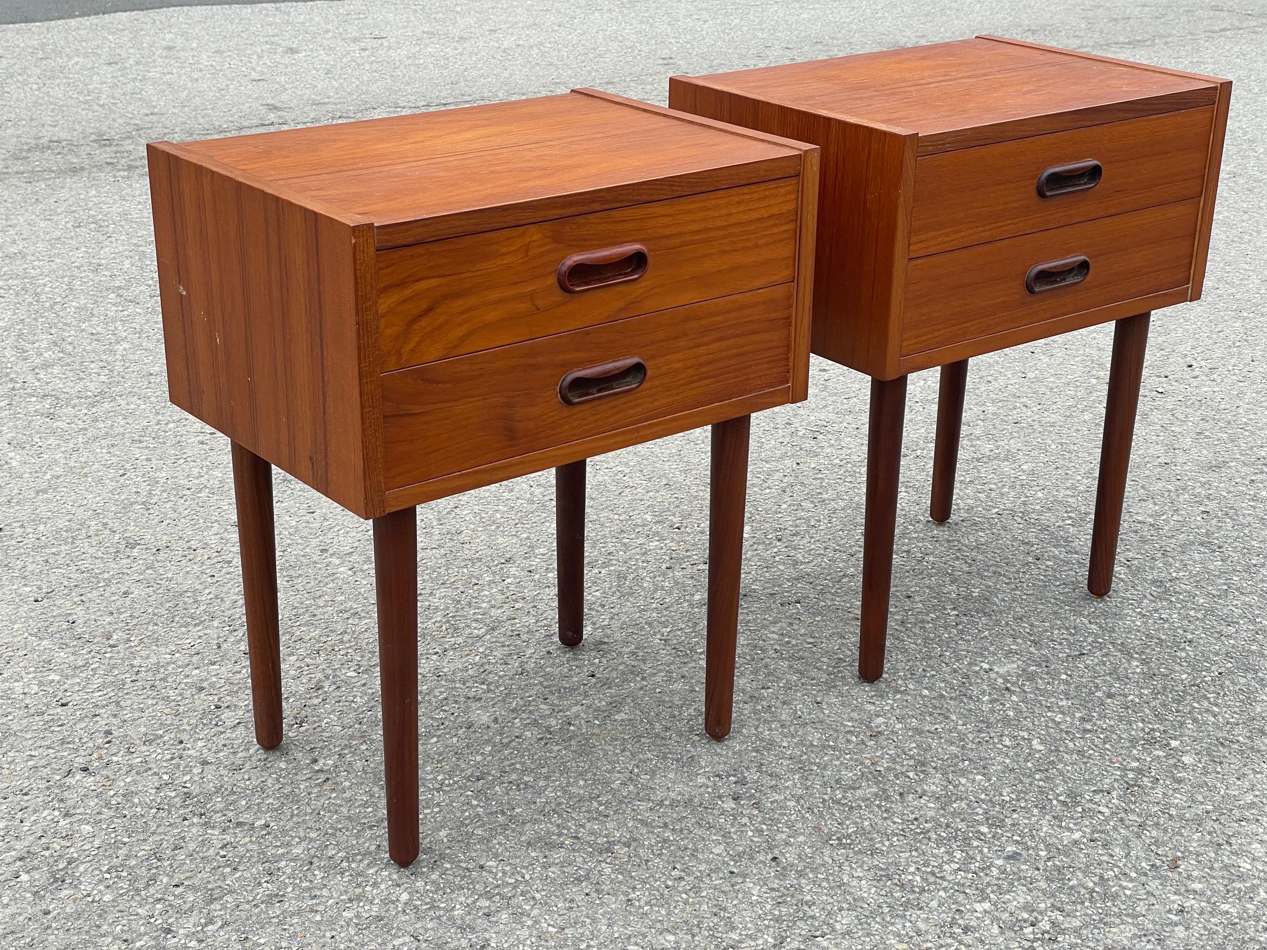 Stunning set of mid-century modern Danish teak nightstands from the 1960s, showcasing the sleek minimalism and timeless elegance iconic to Danish design. This rare, well-preserved pair brings both style and function to any bedroom, offering ample