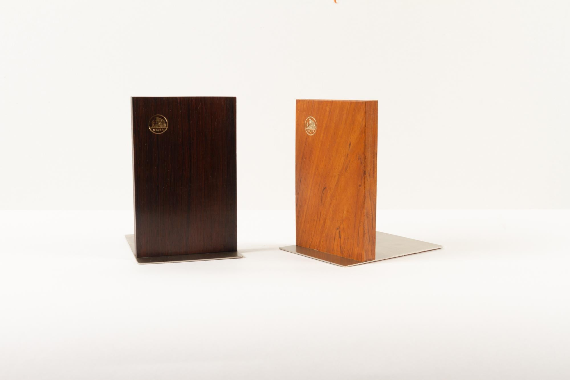 Mid-Century Modern Danish book ends 1960s set of 2.
Pair of solid hardwood book holders with metal feet.
Stamped with golden Wejra logo.
Cleaned and polished. Ready to support.
  