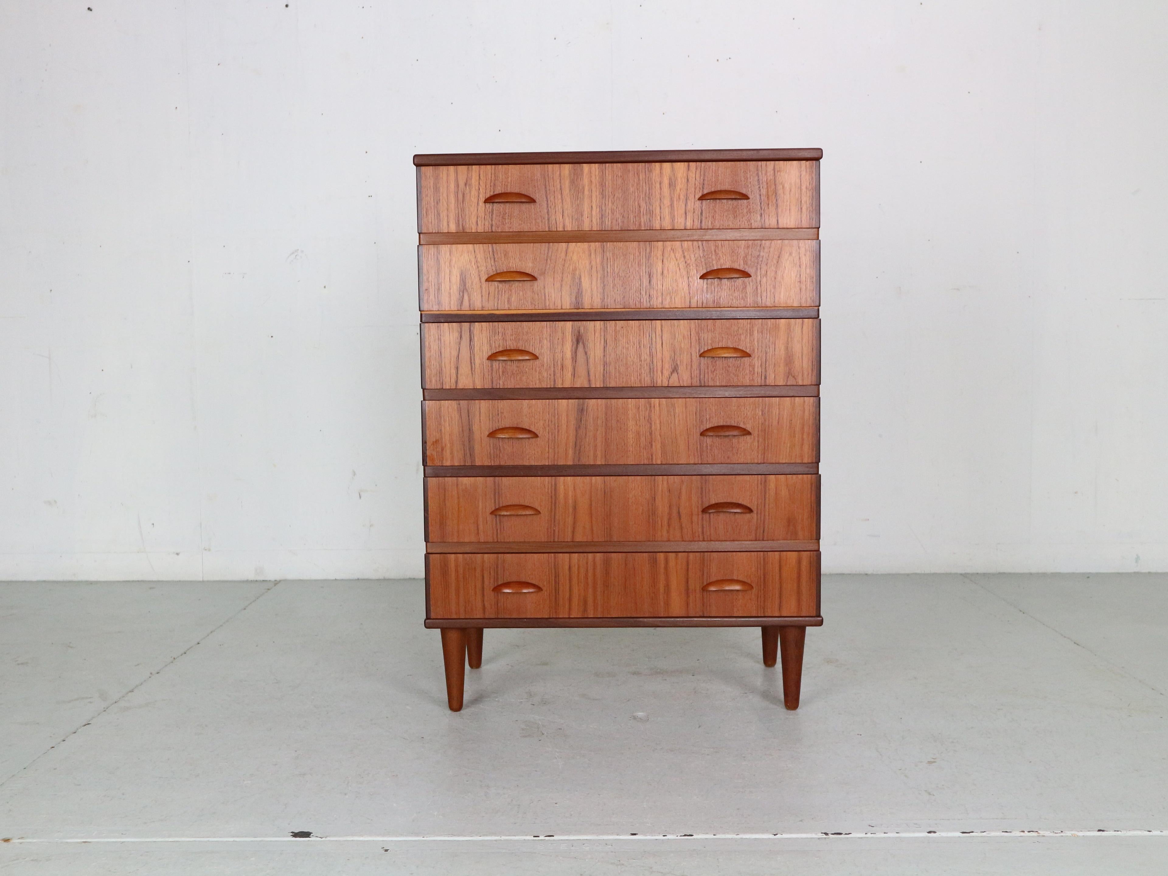 This midcentury danish design chest of 6 drawers, tallboy in teak was made in denmark in the 1960s period. Beautiful minimalistic handles of both sides of the drawers. Curved shape cabinet is an elegant storage space for your vintage and modern