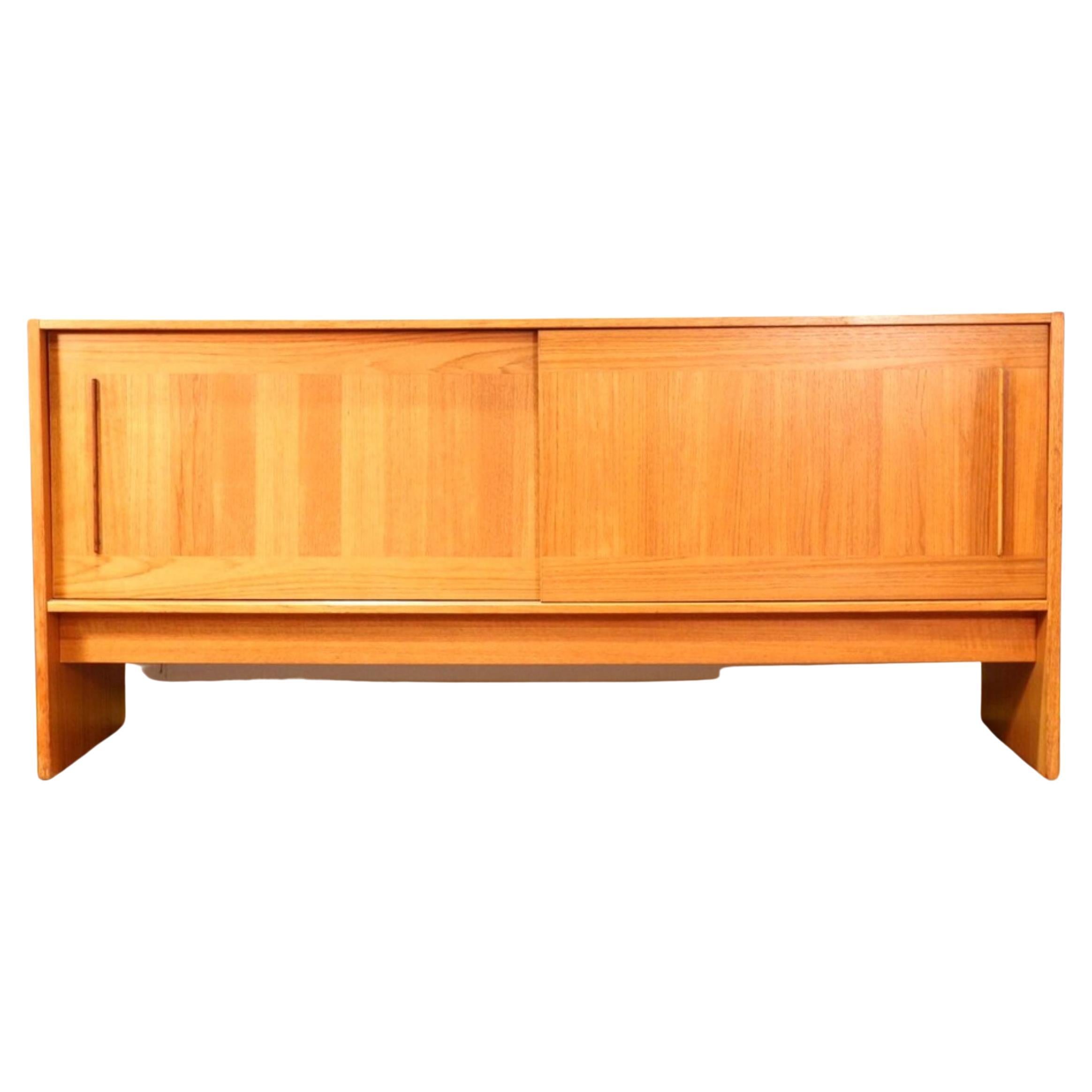 A gorgeous mid-century credenza by Danish designer Gangso Mobler with brilliant storage space that would look great in any space. This piece has great sliding door and signature tiled top which was synonymous with this designer. It is a true