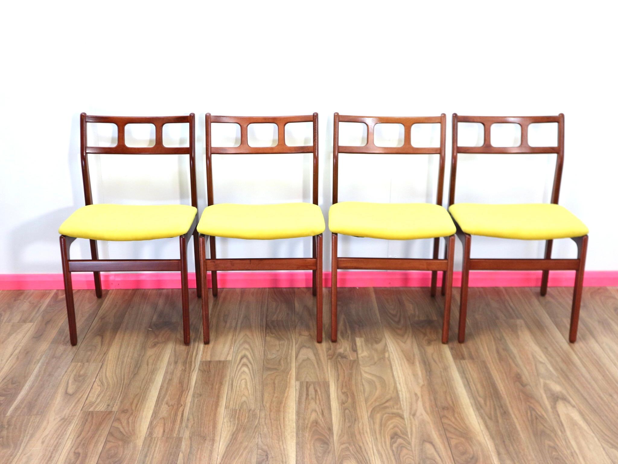 Set of 4 teak attractive mid-century Danish modern reupholstered dining chairs in vibrant yellow. This stylish set has looks, design and beautiful architecture all in one cool package. Attractive frames angle backs, in the manor of JL Moller, with