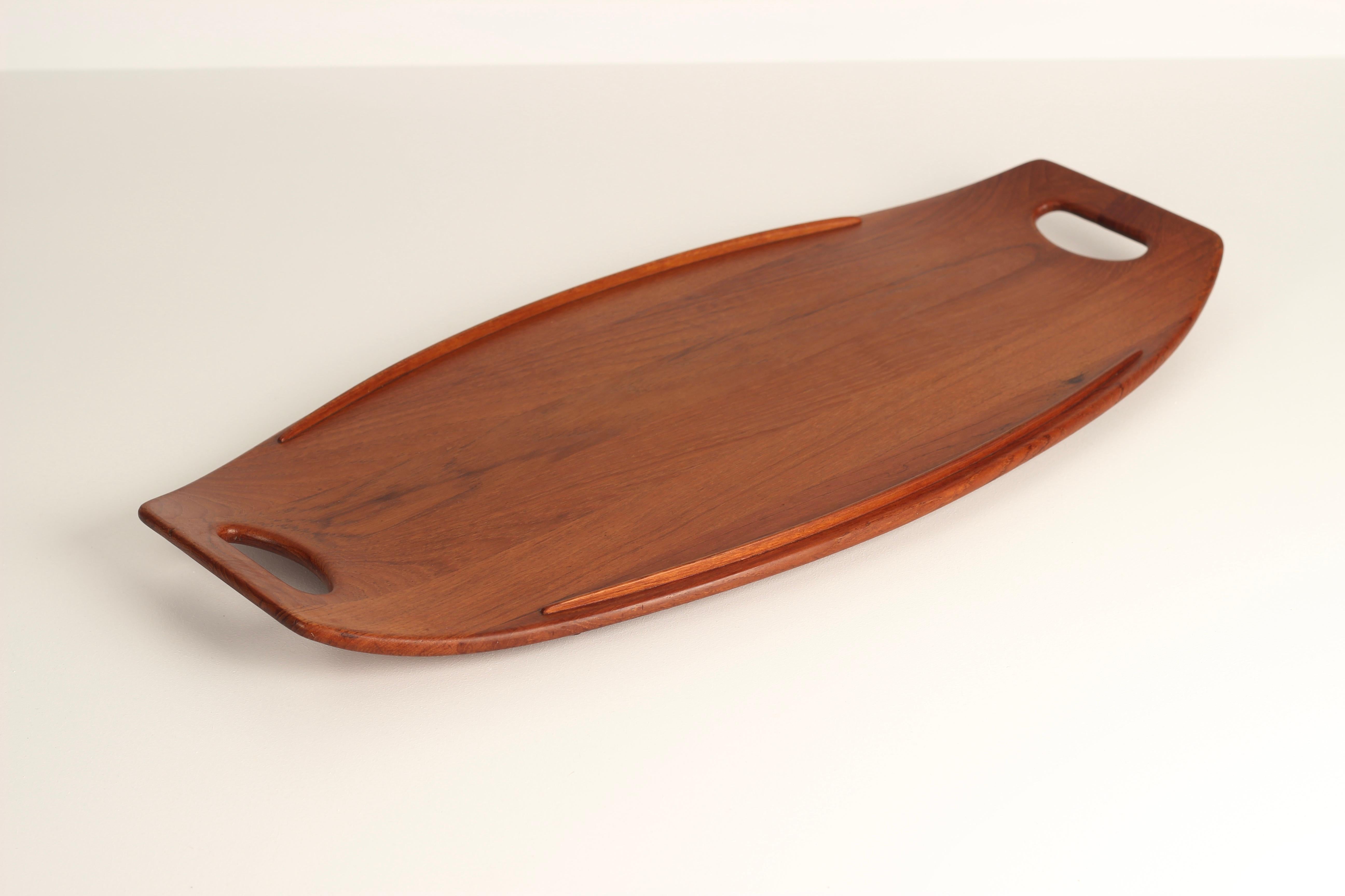 A Mid-Century Modern (Scandinavian Modern) Danish teak tray designed by Jens Quistgaard for Dansk of the USA.

A Teak tray designed by the highly regarded and very collected Jens Harald Quistgaard, a Danish sculptor, artist and industrial