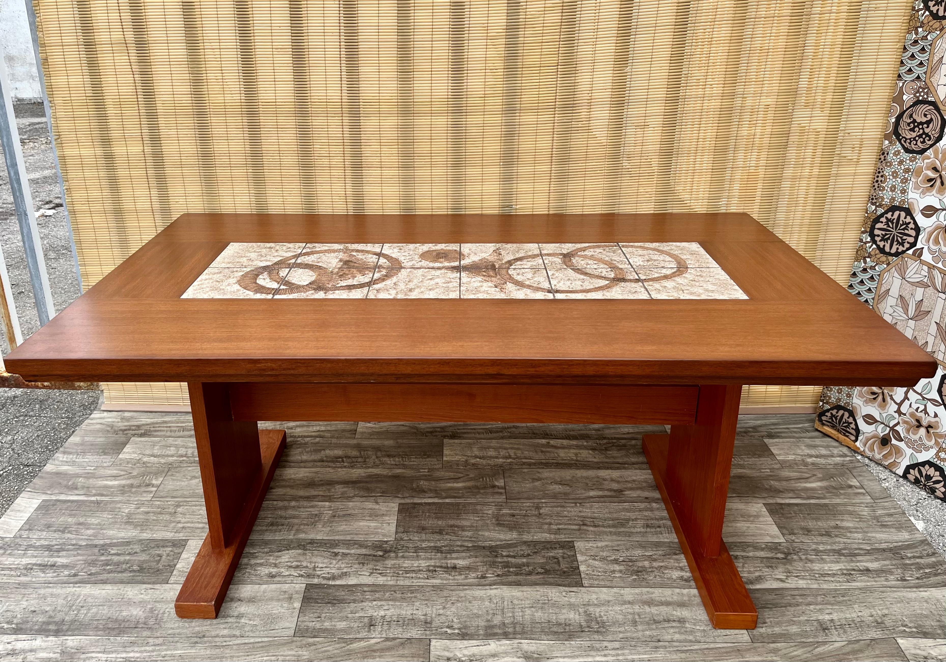 Vintage Mid Century Modern Danish Dining Table With Ceramic Tile Inlay. Circa 1970s
Features quintessential Mid Century Modern Scandinavian design with a brutalist ceramic tile inlay top. 
Comfortably seat six guests. 
In excellent refinished