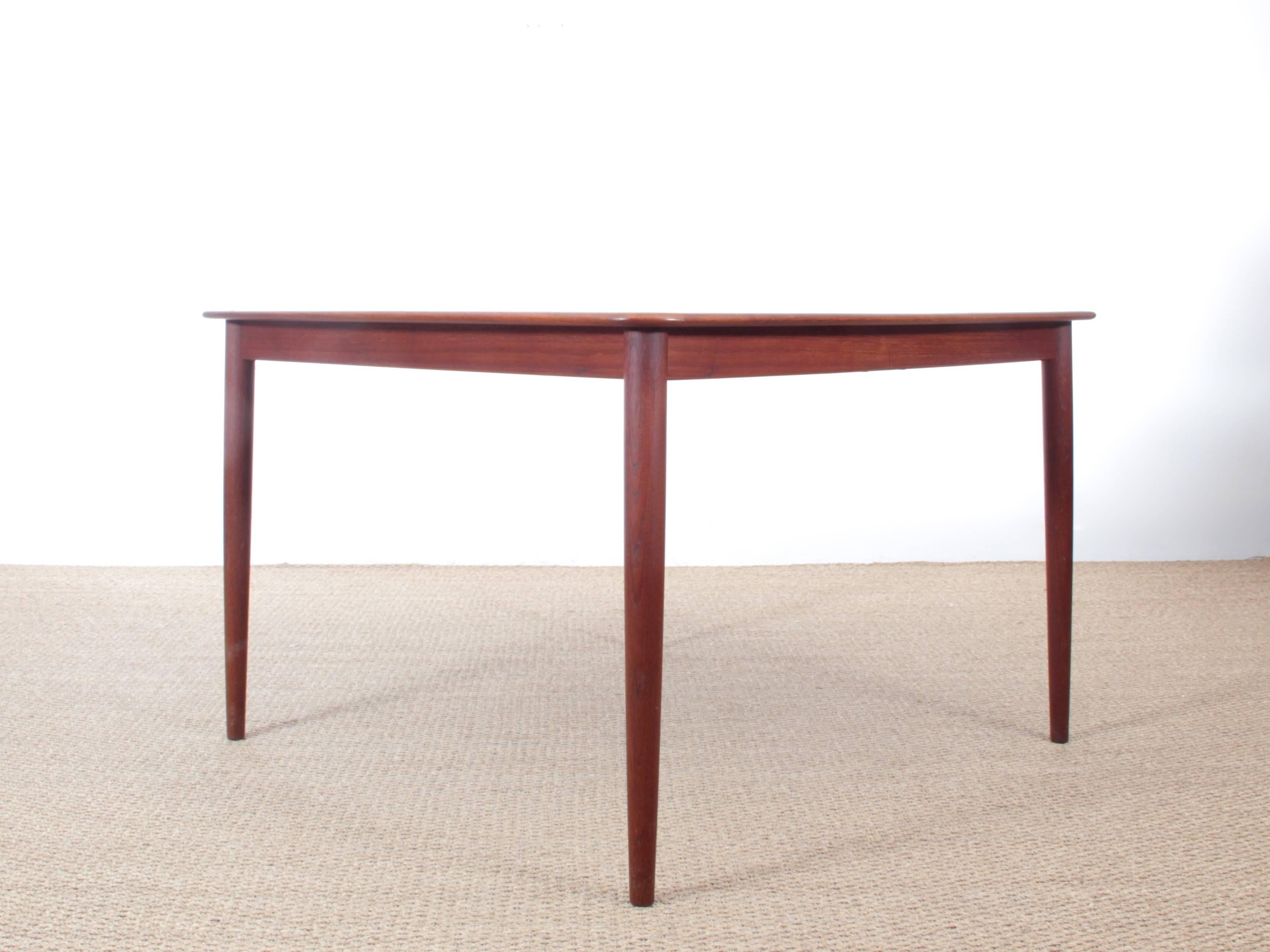 Mid-Century Modern Danish extendable dining table in teak four-ten seats. Two extra leaves. Rare original condition.