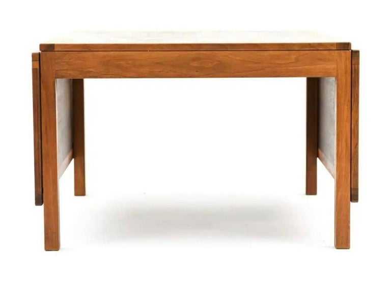 A Danish Mid-Century Modern extension coffee table designed by Børge Mogensen for Fredericia in the 1960s. This table is model 5362/574 and cleverly features two drop leaves that allow the table to expand or contract depending on available interior