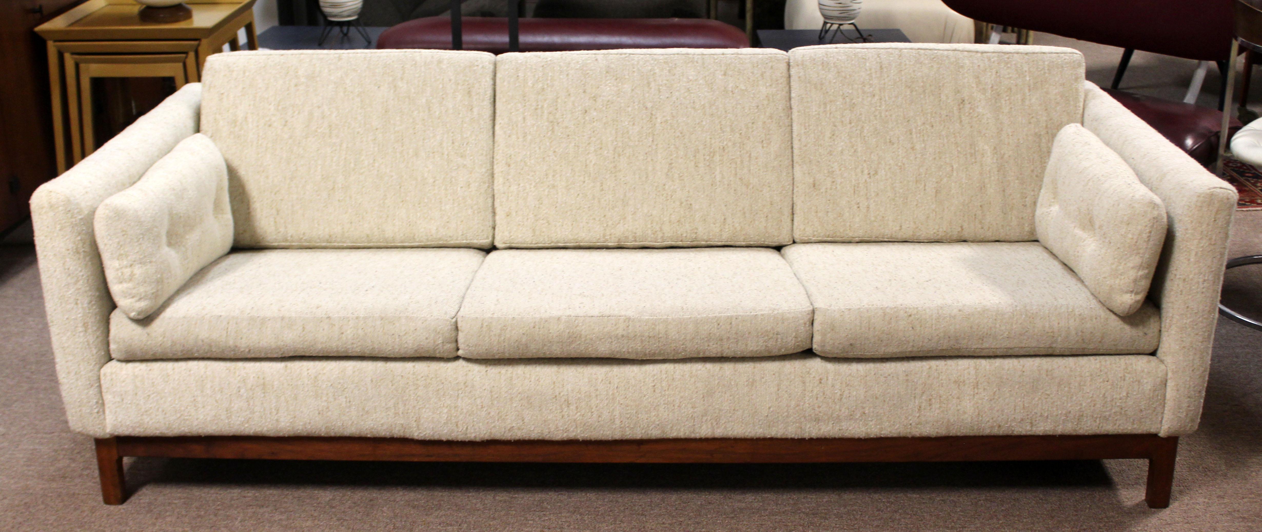 For your consideration is an incredible, three-seat sofa, on a beautiful walnut base, by DUX, circa 1960s. In excellent condition. The dimensions are 83