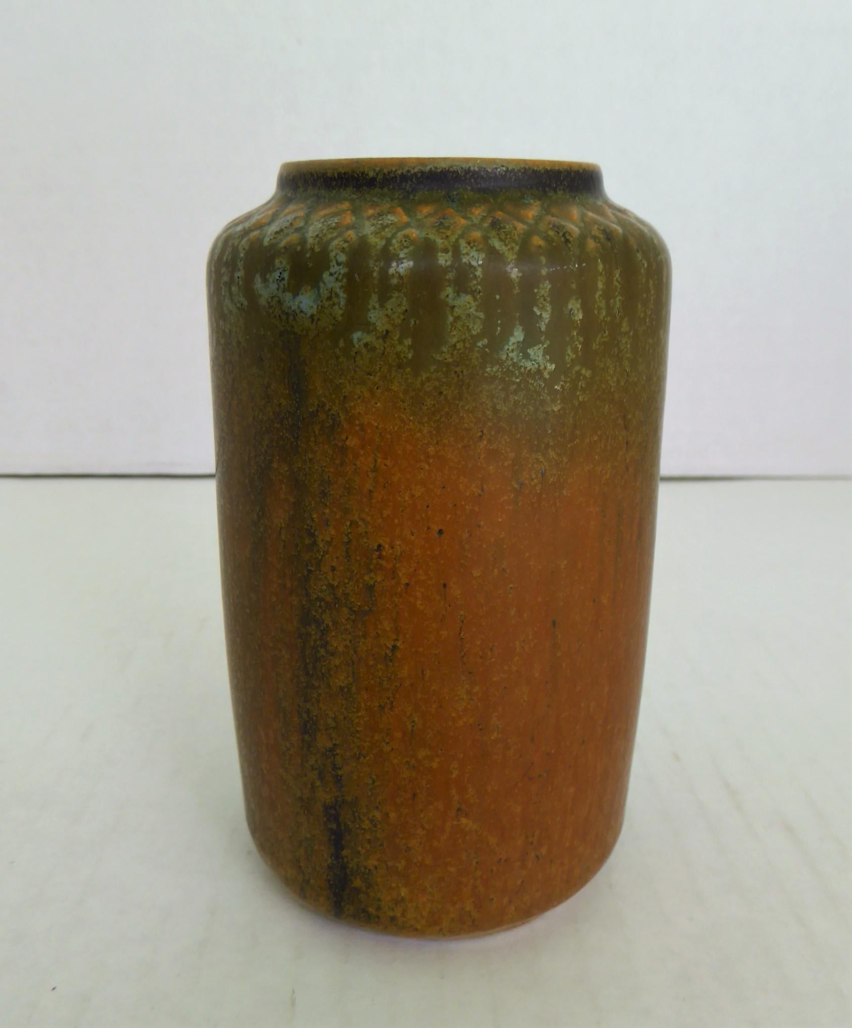 Danish Mid-Century Modern vase by Dane Ejvind Nielsen (1916-1988). Hand thrown and made in his atelier in the 1960s. There is not much information about Nielsen's life except that he spent time in England, Spain and he worked for a time at Royal