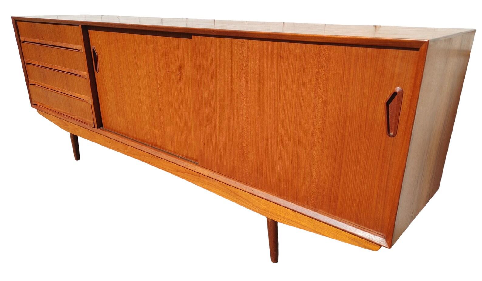 Mid Century Modern Danish Inspired Teak Credenza by Clausen and Sons

Above average vintage condition and structurally sound. Top has been refinished and does not original factory finish.  Has expected age related wear and scratching.  Please