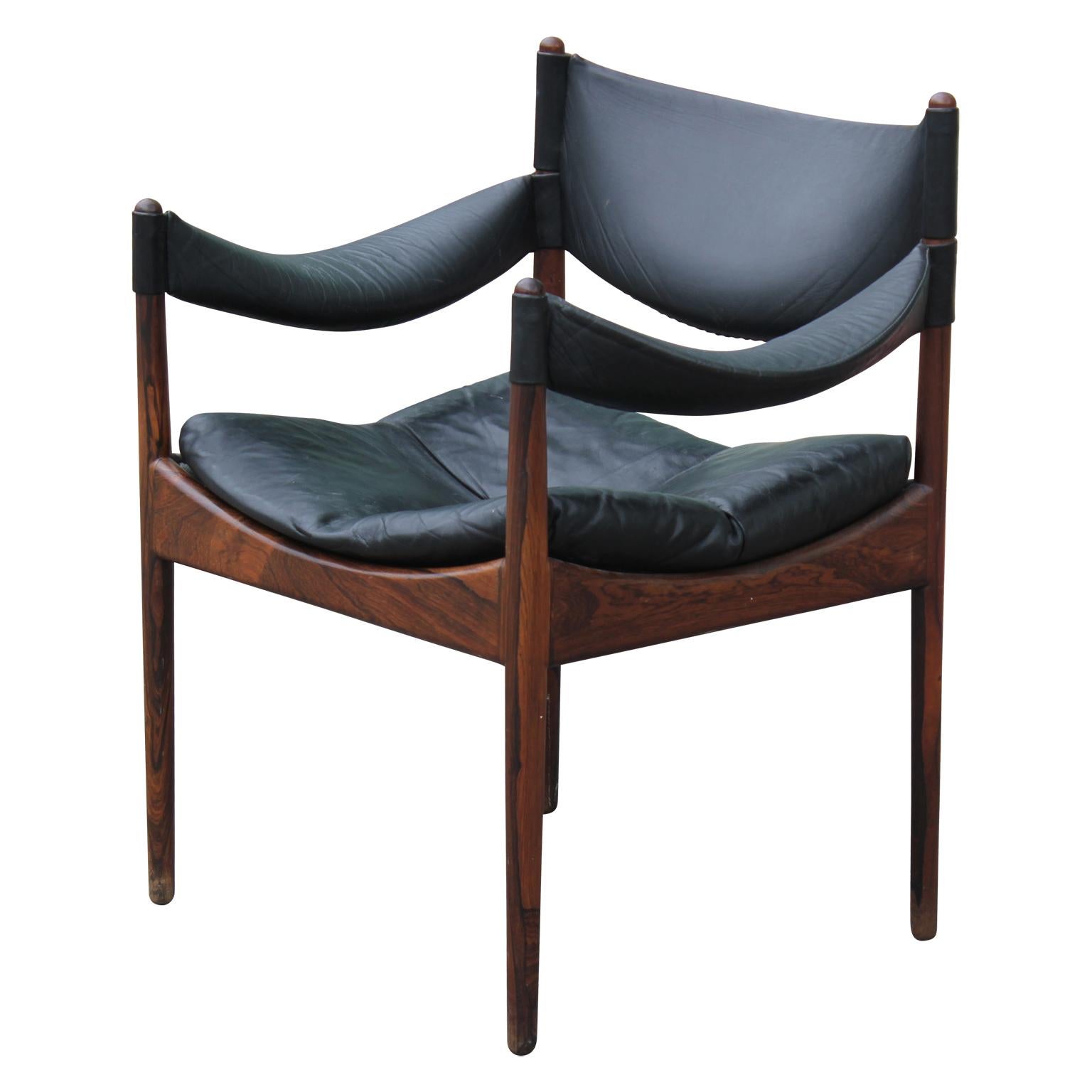 Sleek Mid-Century Modern Danish lounge chair in rosewood model Modus. This leather and rosewood chair was designed by Kristian Vedel for Søren Willadsen, Denmark. This is Vedel's most popular design and came in slightly different variations.