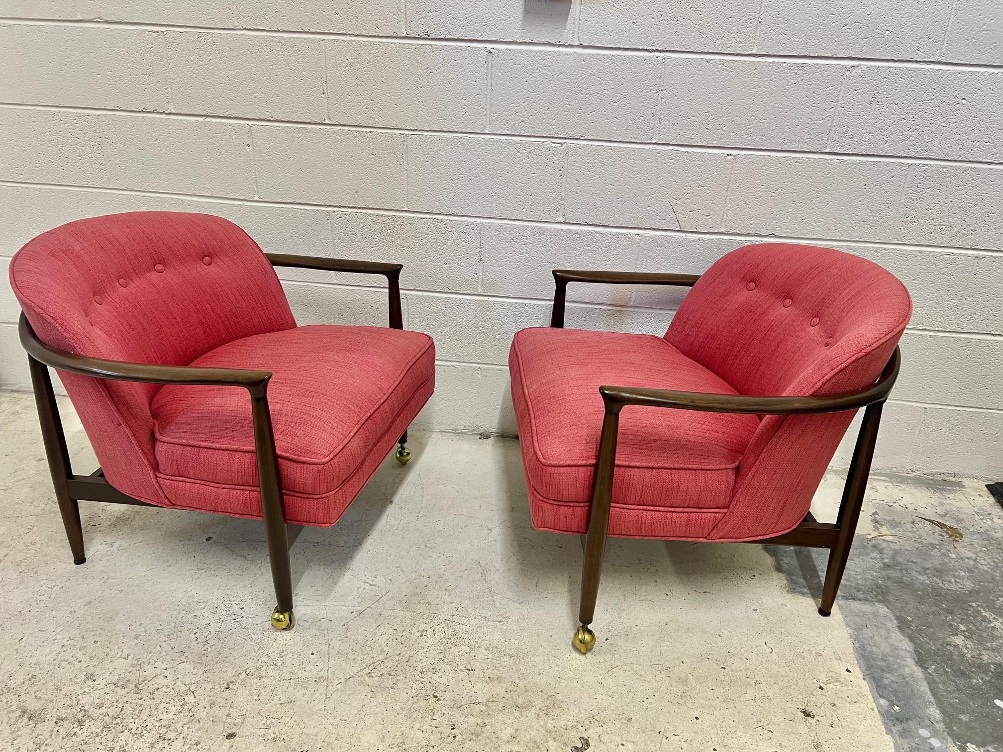 Mid century modern walnut lounge barel club chairs by Finn Andersen for Selig. Price is for one chair. Original label underneath the chair. Upholstery appears to be original and is in very good condition. Some stains as shown in pictures. Wood frame