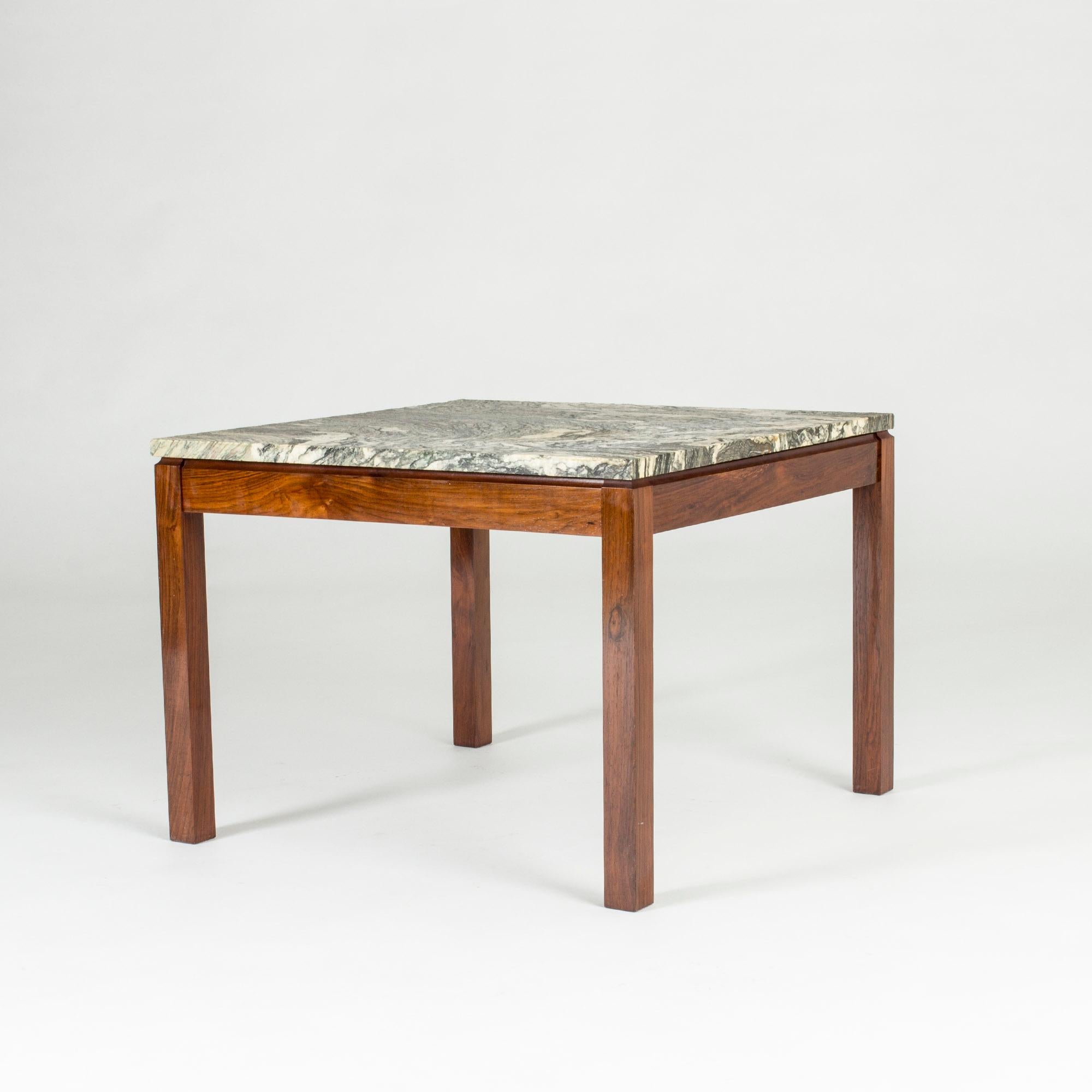 Neat Danish 1960s marble coffee table. Rosewood base and square marble table-top with a striking pattern.