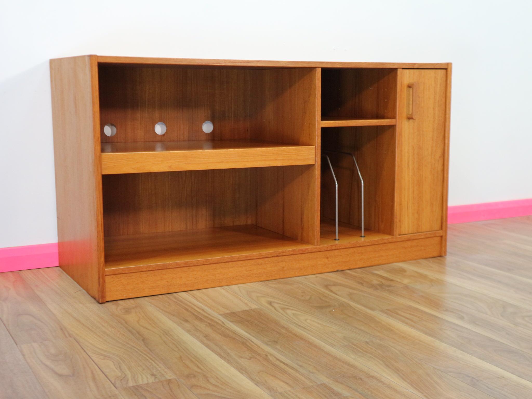 This fantastic Danish media cabinet made by Mobler in the 1960's is a fantastic functional piece of furniture. It has a slide out table great for a record player, a sliding cupboard which originally would have been used for tapes but can be used for