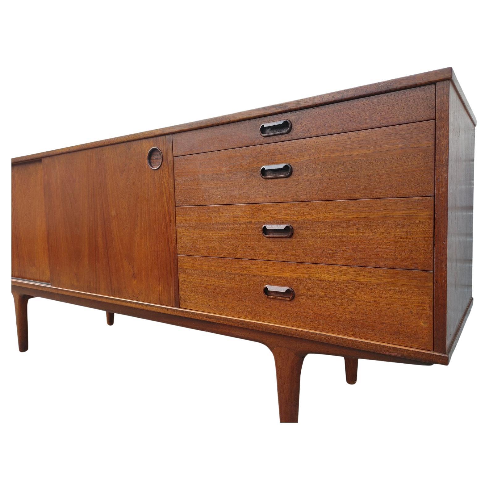 Mid Century Modern Danish Modern Credenza by McIntosh 

Above average vintage condition and structurally sound. Has some expected slight finish wear and scratching. Top has been refinished and does not have original factory finish. Outdoor listing