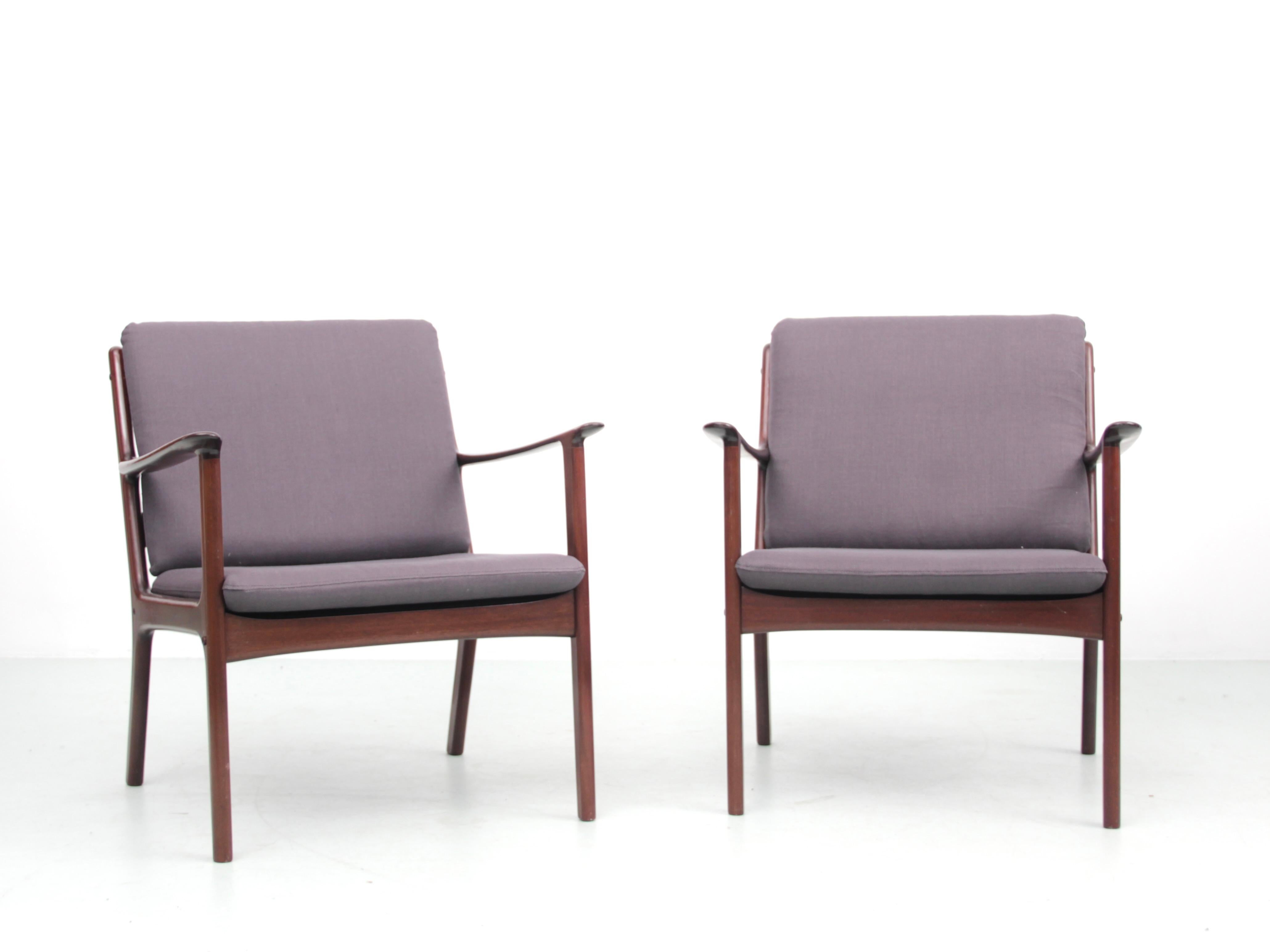 Mid-Century Modern Danish pair of lounge chairs in mahogany model PJ 112 by Ole Wanscher. Black leather cushion or patinated cognac leather cushion.
