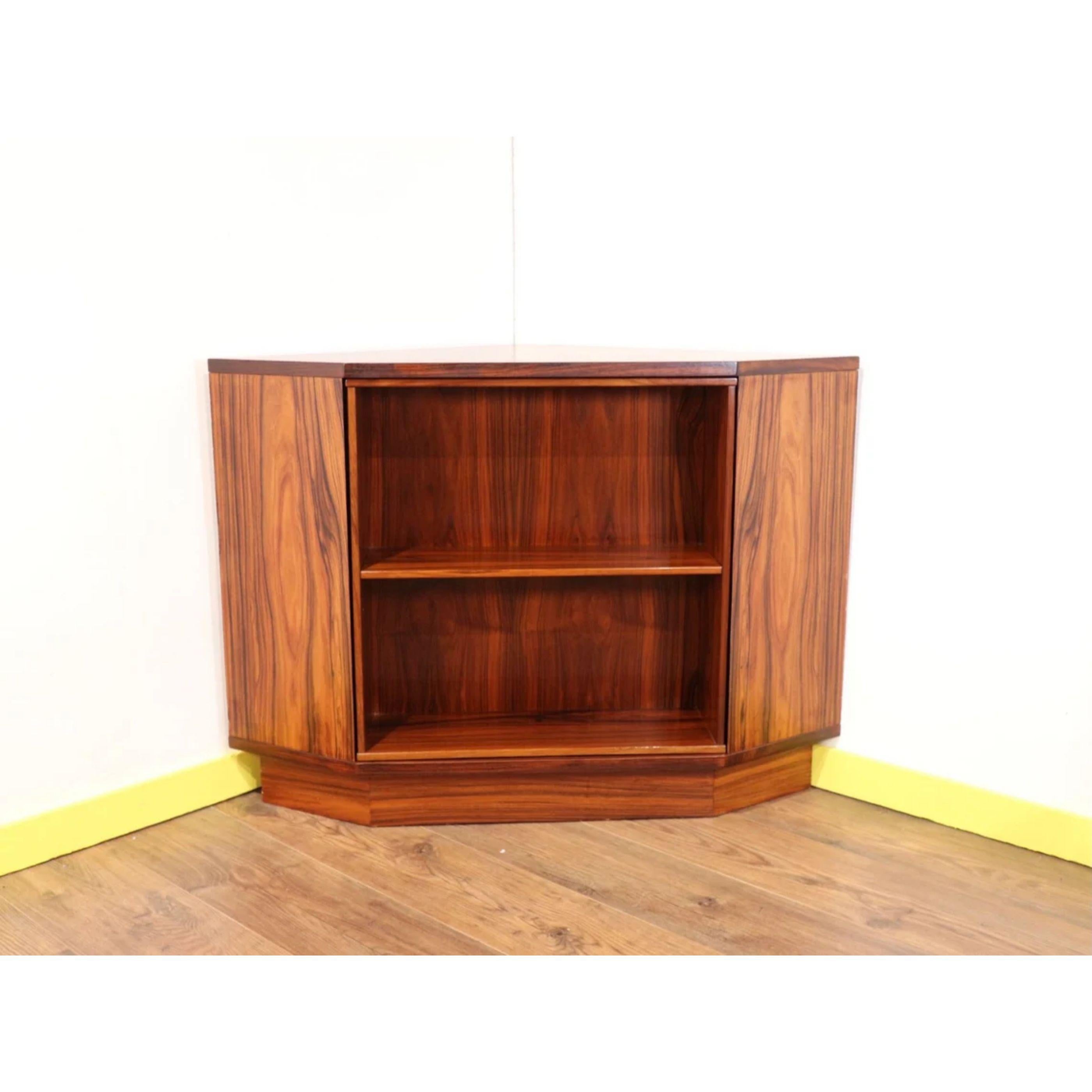 This fabulous mid-century corner revolving secret bar is an fabulous an piece of furniture. This is Danish design and quality summed up in one piece. The Cabinet features an amazing revolving drinks bar and display cabinet so you can eith display