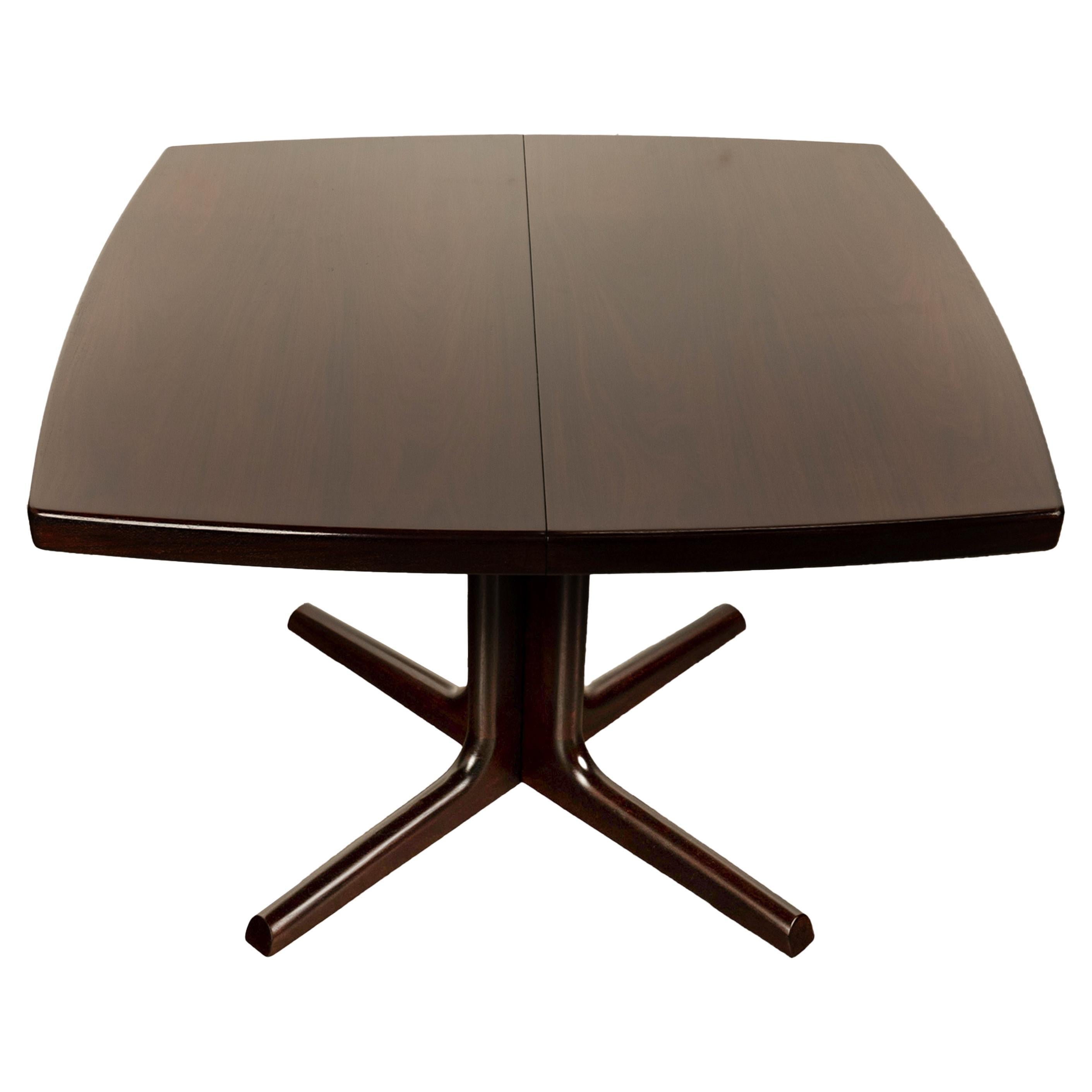 A very good Mid Century Modern Danish rosewood extending dining table with two leaves, by Farstrup Mobler, circa 1965.
This very stylish Danish MCM table having gently curved sides & ends, it is almost square without the leaves inserted, perfect for