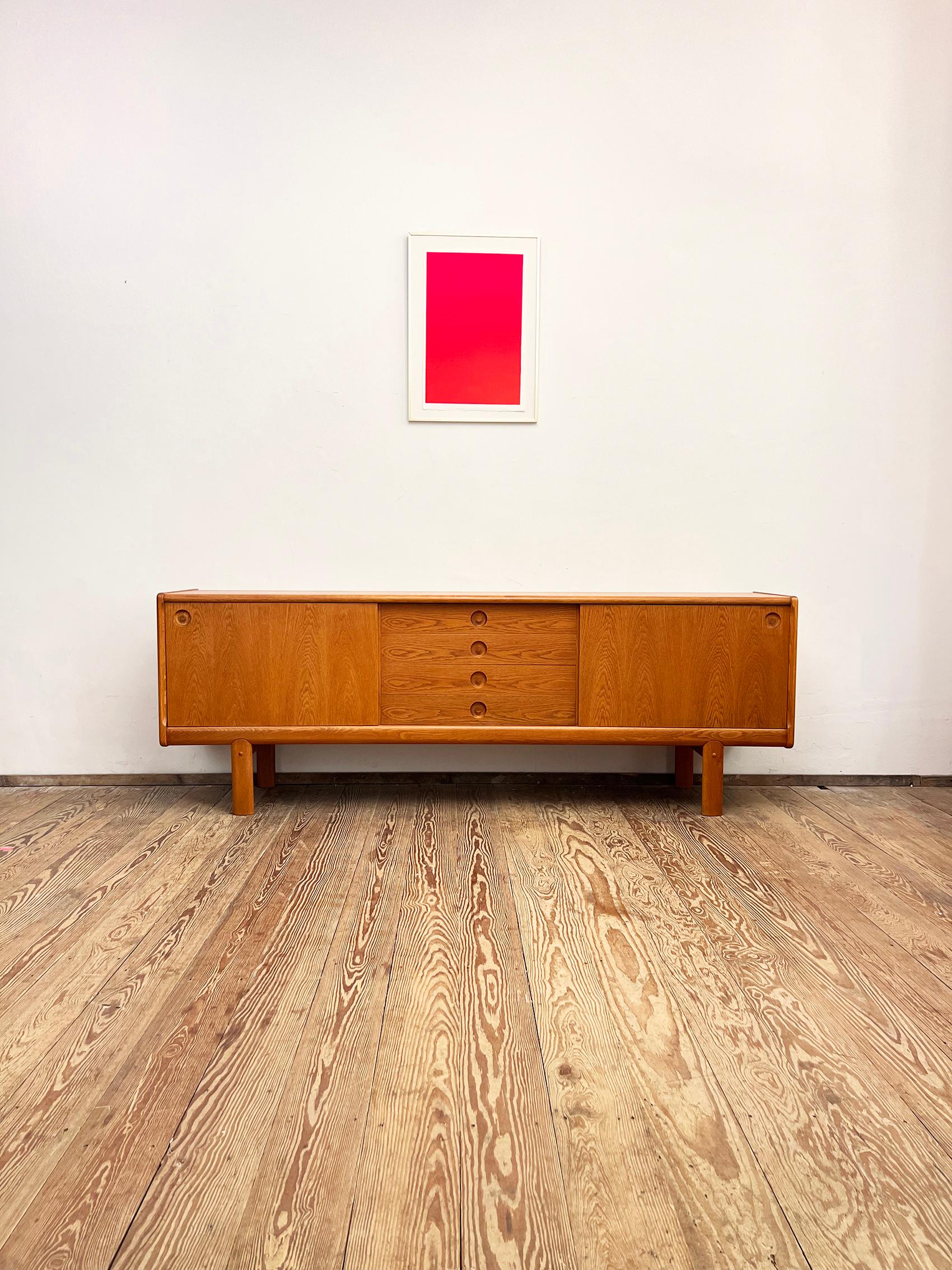 Dimensions: 223 x 45 x 80 cm ( (Width x Depth x Height)

This mid century modern credenza was designed in the 1960s by H.W. Klein and manufactured by Bramin in Denmark.

The Scandinavian design shows exquisite Danish craftsmanship and offers plenty