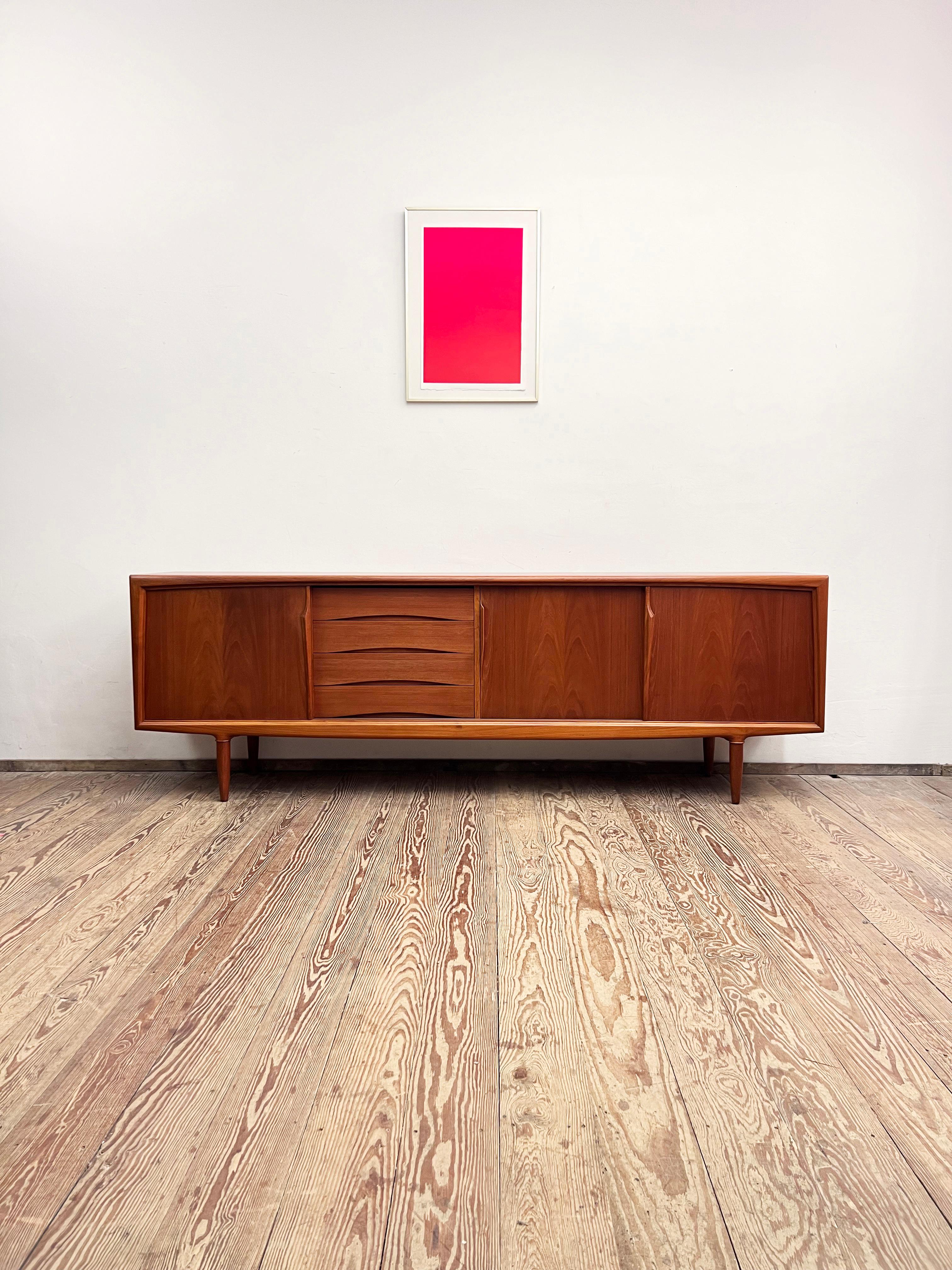 Dimensions: 240x50x80 cm (Width x Depth x Height)

This Scandinavian design sideboard or TV console was manufactured in the 1950s by Axel Christensen Odder or ACO in Denmark.

The mid-century Credenza showcases exquisite Danish design and
