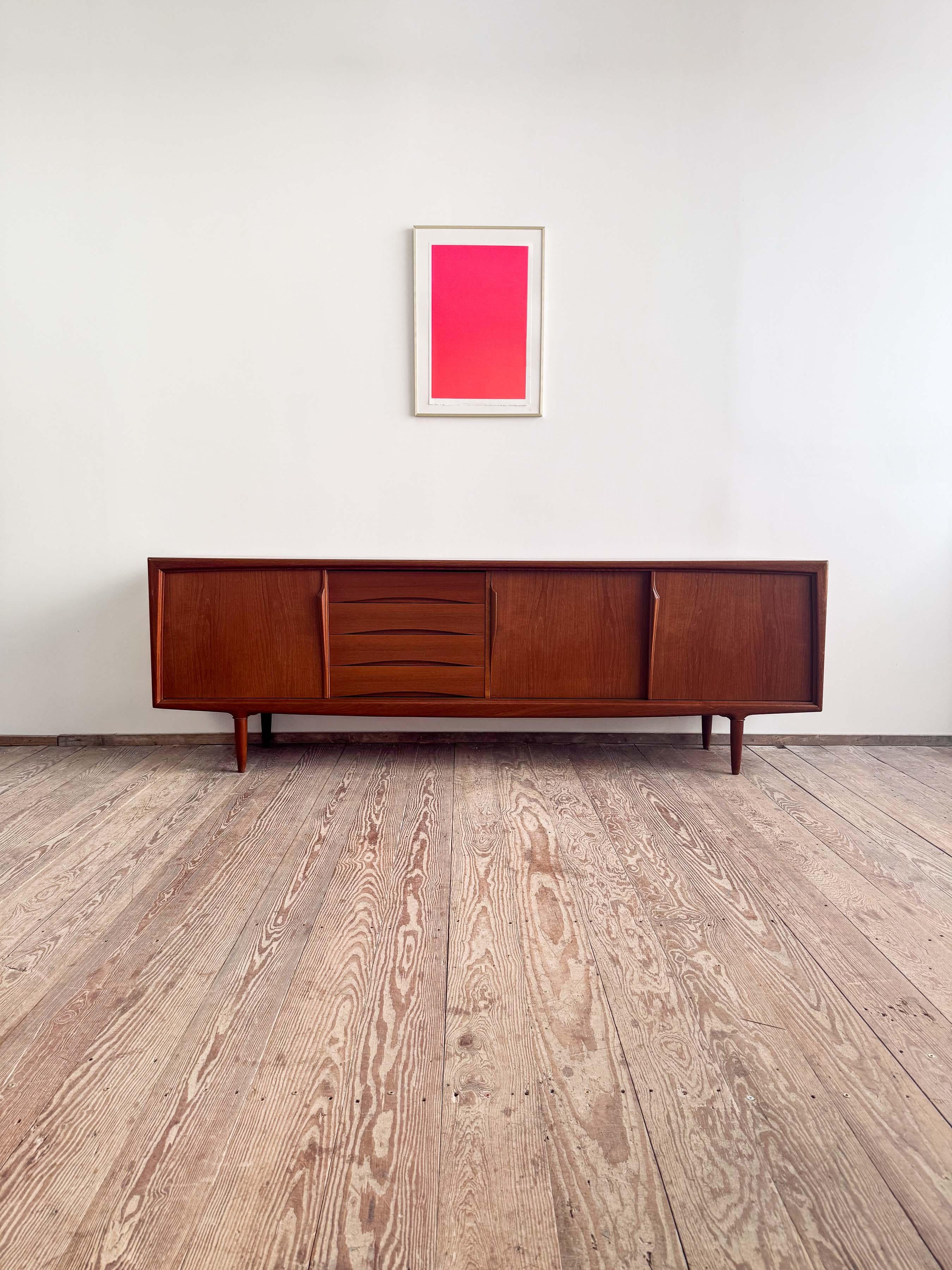Dimensions: 240x47x80 cm (Width x Depth x Height)
Dimensions: approx. 94.5 x 18.5 x 31.5 in

This Scandinavian design sideboard or TV console was manufactured in the 1950s by Axel Christensen Odder or ACO in Denmark.

The mid-century Credenza