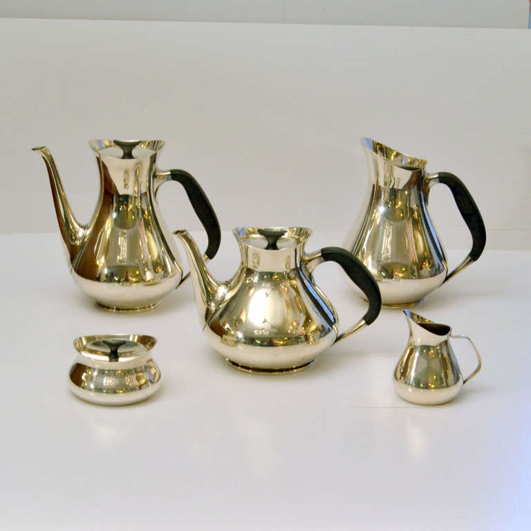 Mid-Century Modern streamlined silver plated tea and coffee set including sugar bowl, milk jug and water jug was designed by Hans Bunde for Cohr in 1960's, Danish.
The set is ready to use for tea and coffee. The lids have a special fitting so they