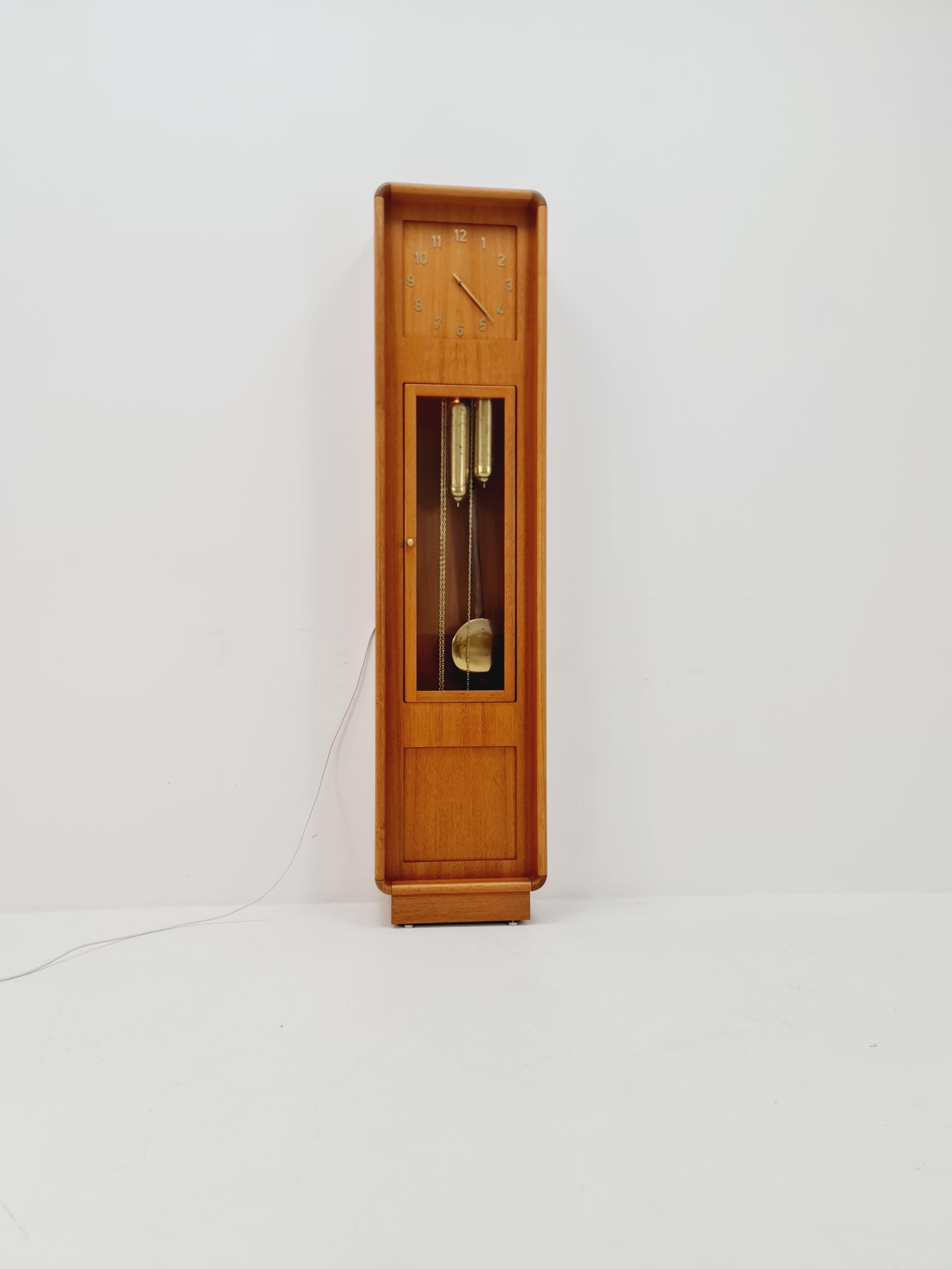 Mid-Century Modern Danish stand clock in Teak By Westminster clocks copenhagen  1960
Made in Denmark  
Dimensions: 
24  D x 43  W x 185  H cm

It is in good vintage condition, however, as with all vintage items some minor wear marks should be