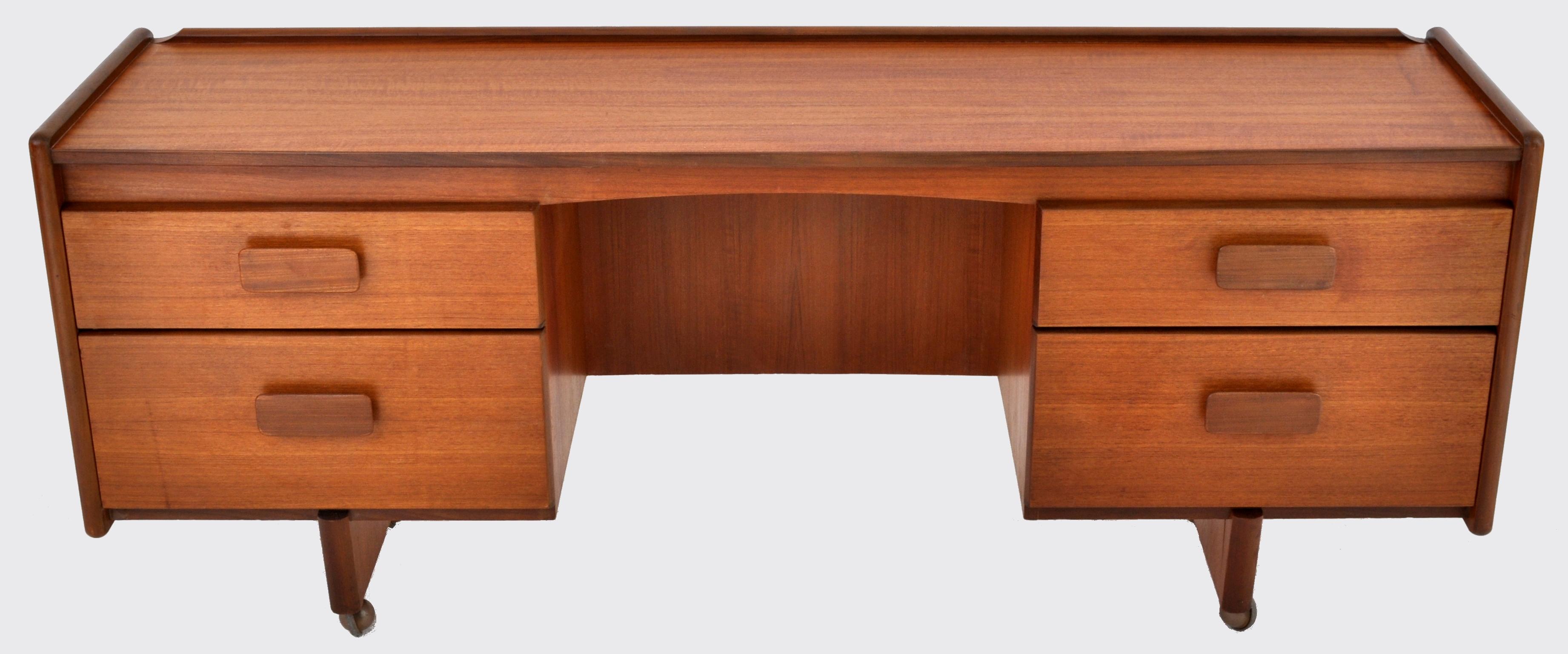 Mid-Century Modern Danish style desk in teak by White & Newton Ltd., 1960s. The desk having a low gallery to the sides and back, having twin pedestals, each with two drawers with unusual rectangular block handles. The desk raised on block-shaped