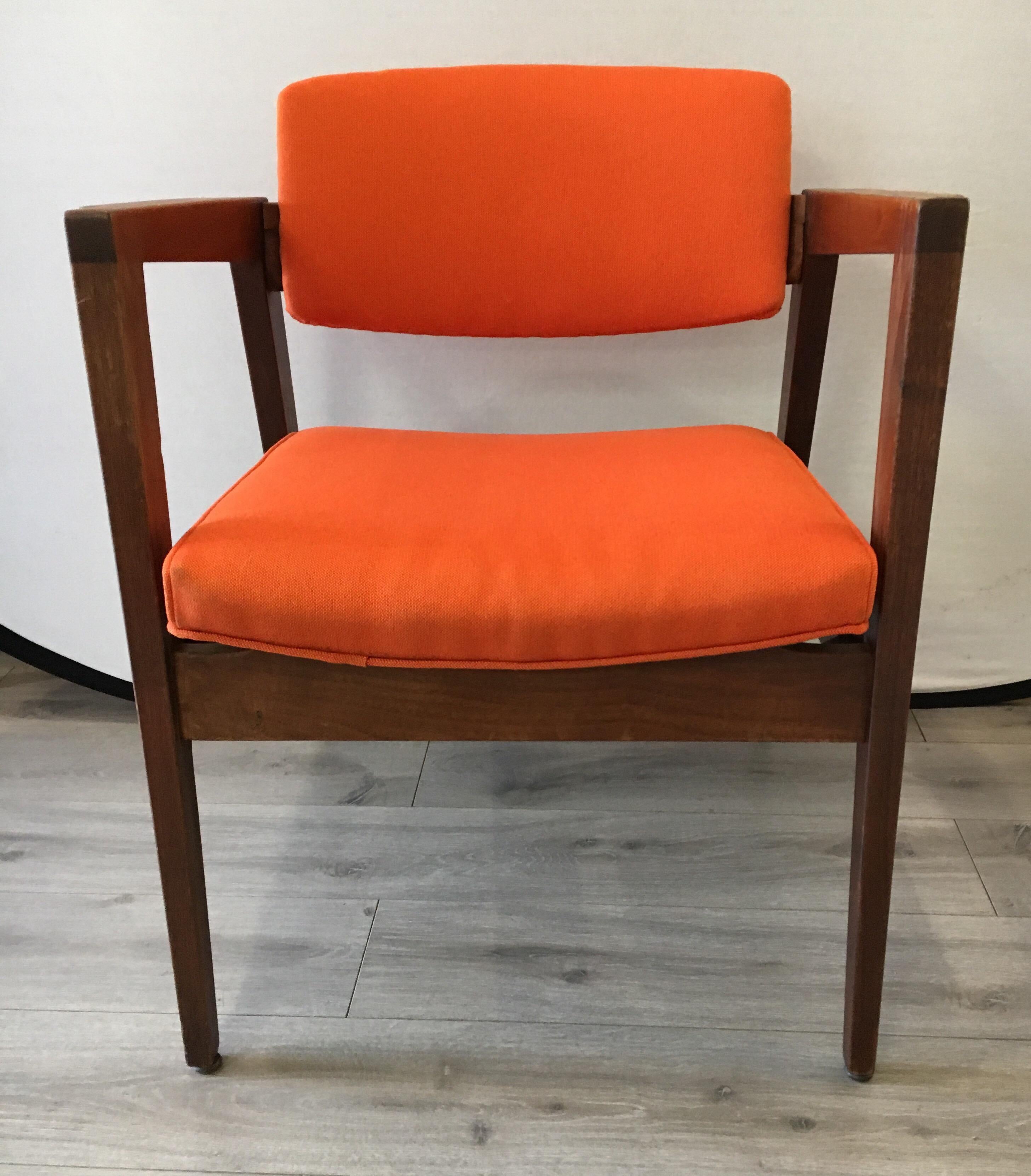 Danish modern walnut and teak lounge chair with newer Hermes orange colored upholstery.
Made in NY in the 1960s.