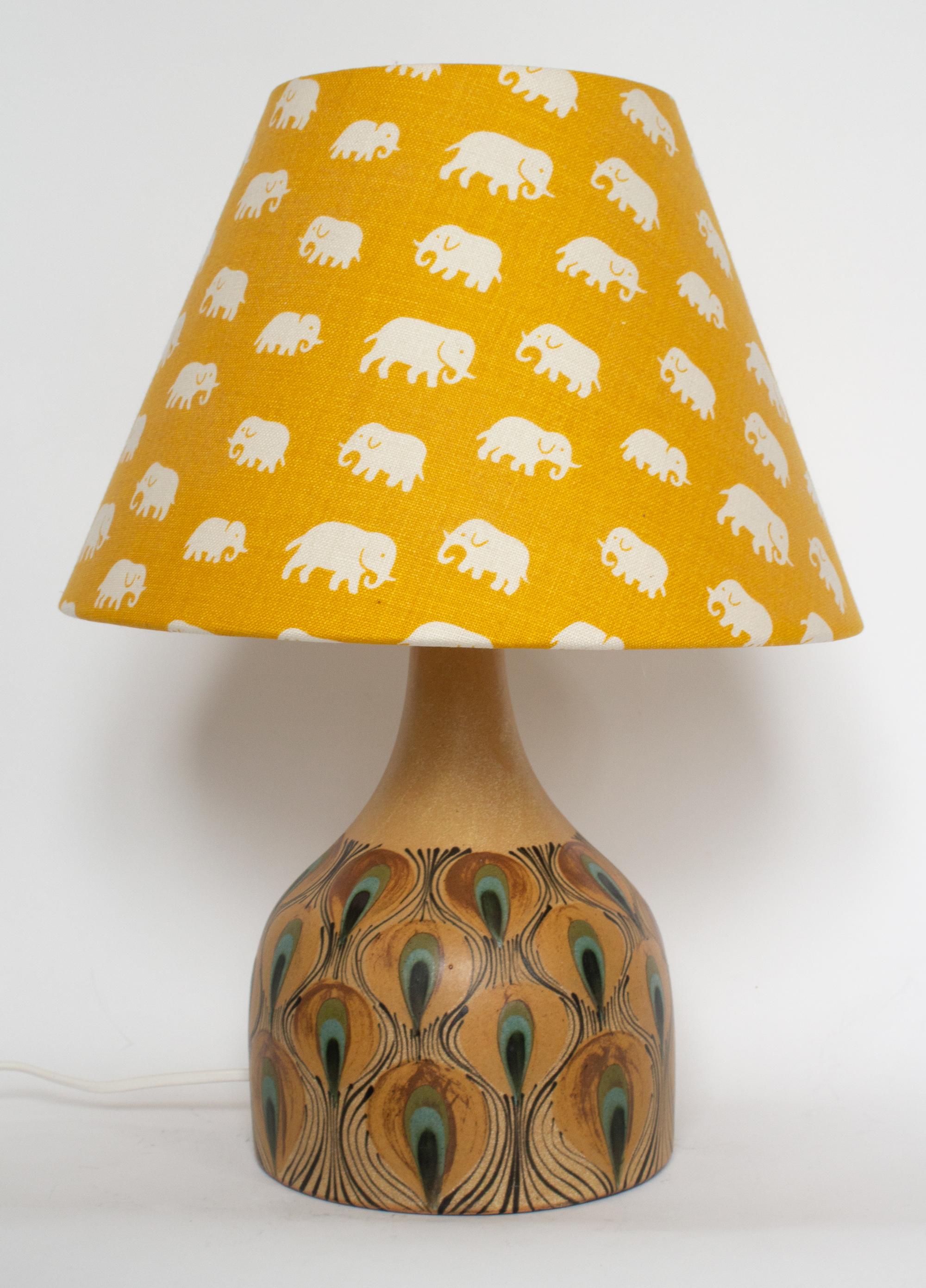 Mid-Century Modern Danish table lamp with peacock pattern by Dybdahl. Unconventional and charming ceramic table lamp, suitable for any interior with a Bloomsbury twist. Sells without the lampshade, so that you can add your own