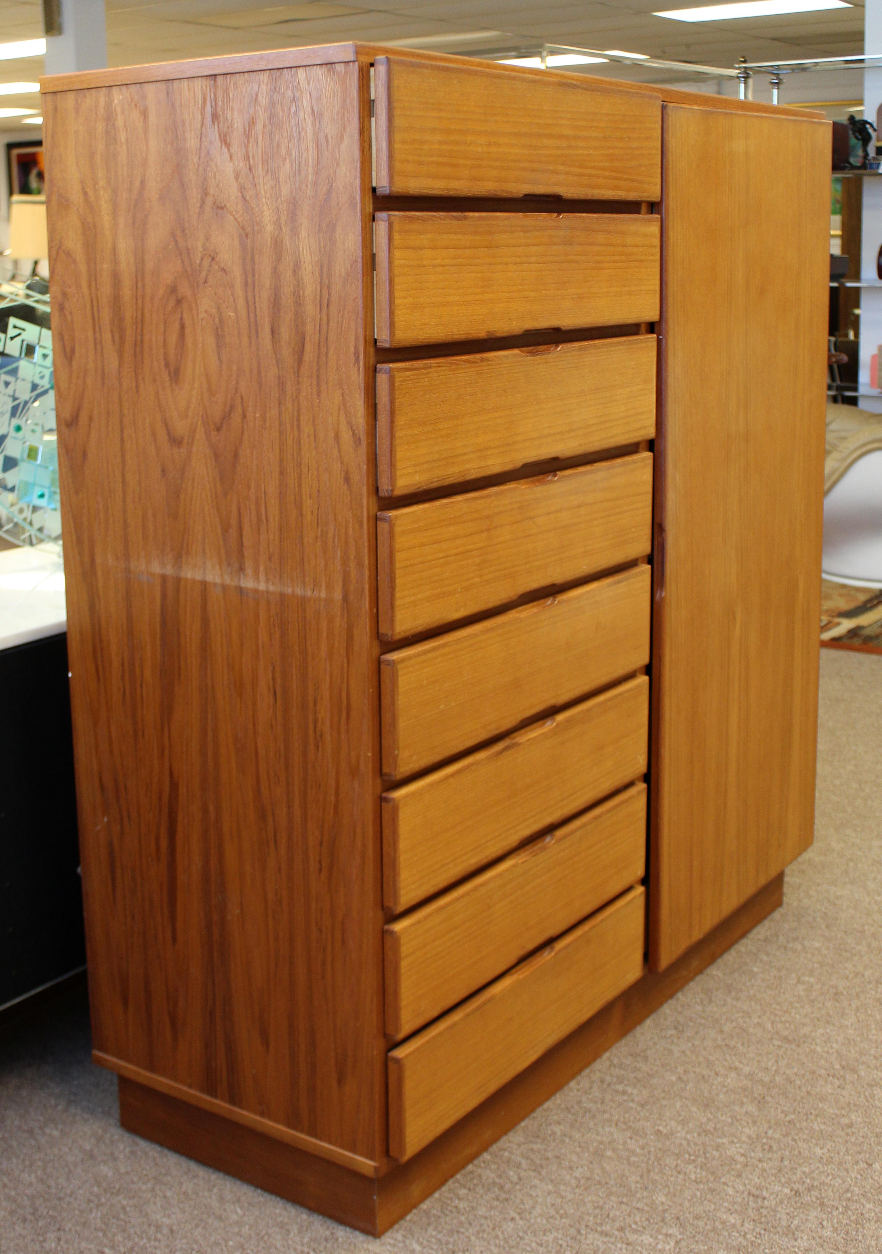 For your consideration is a wonderful, teak dresser, with ten drawers, made in Denmark, circa 1960s. In very good vintage condition, with a break in the wood near a hinge. The dimensions are 49