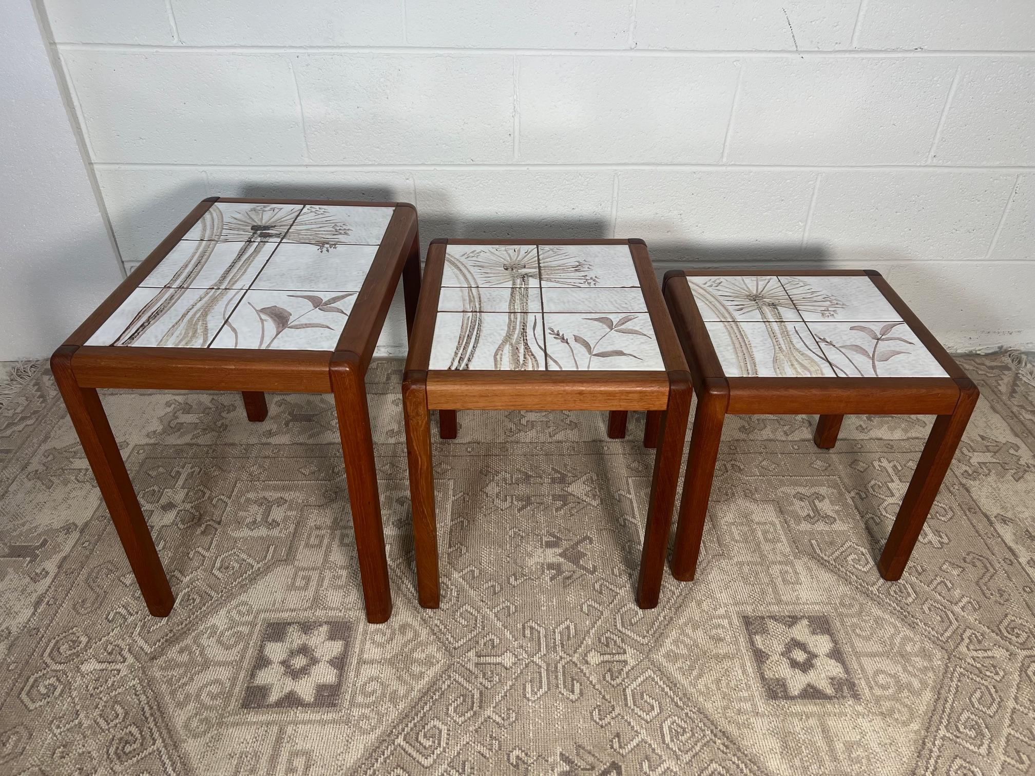 Mid-century modern teak and tile nesting side tables. Made in Denmark. Stamped underneath. Very good condition. Very minor marks.

Dimensions: L x W x D

20.25