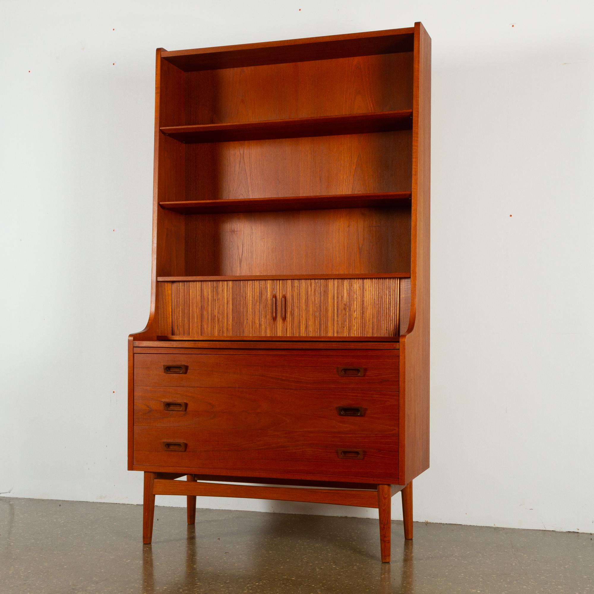 Mid-Century Modern Danish teak bookcase, 1960s
This Classic Scandinavian bookcase was designed by Danish master carpenter Johannes Sorth for Nexø Møbelfabrik, Bornholm in 1956. The idea was to combine a cabinet and a book case, and it was an
