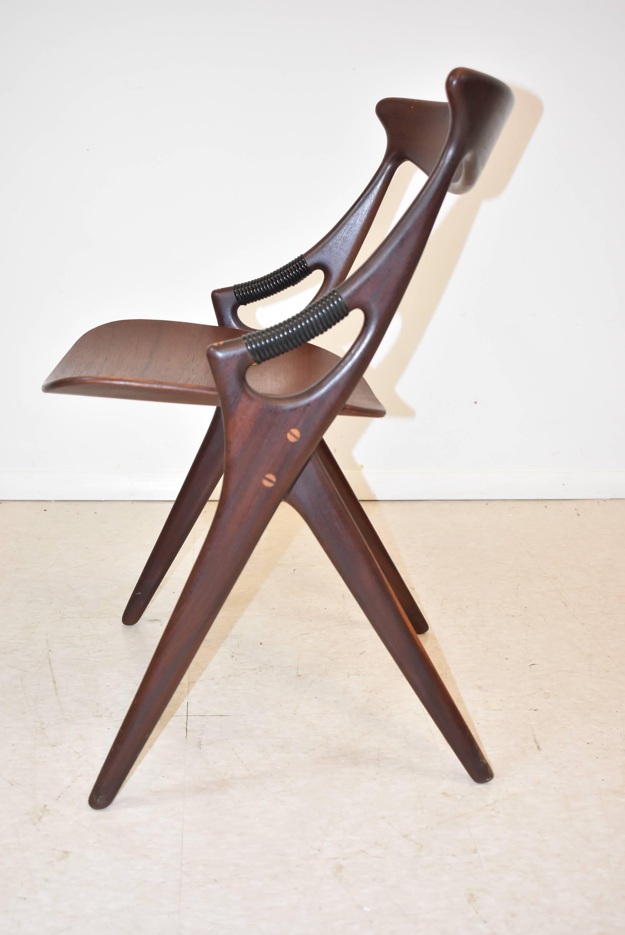 A park of model 71 chairs by Arne Hovmand Olendm, (Denmark 1919-1989) for Mogens Kold Møbelfabrik, circa 1950s. This chair has a unique shape with the most amazing teak arms with wrapped arm supports and bent plywood seats. The chair has subtle