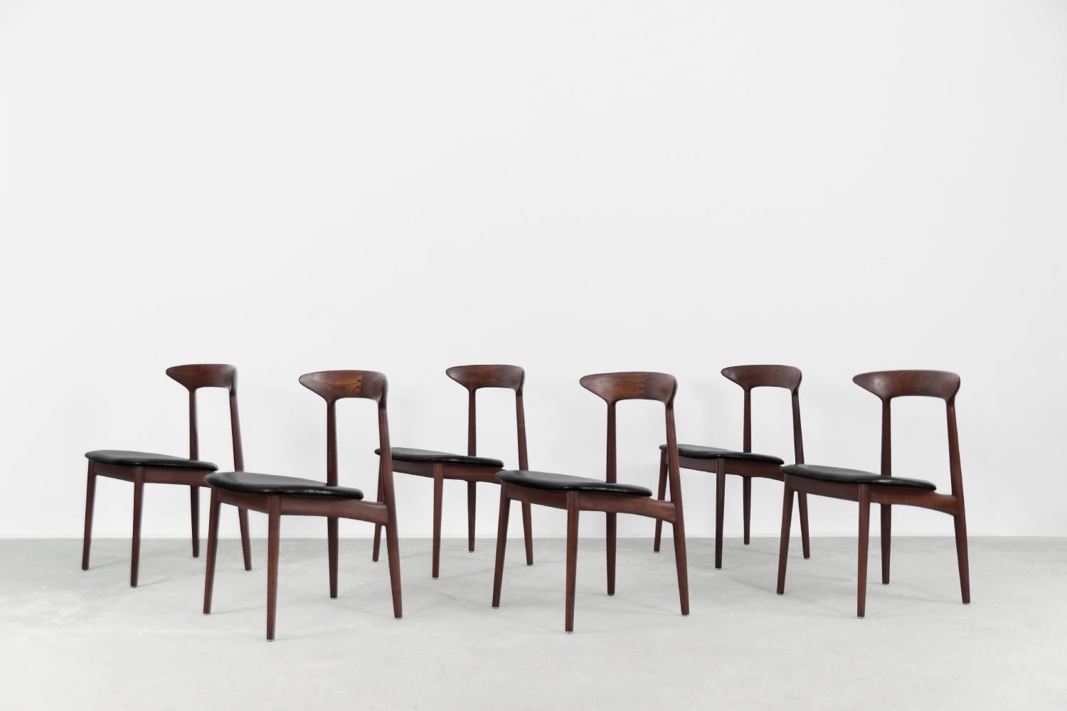 This set of six modernist dinning chairs was created by Danish designer Kurt Østervig during the 1960s. The chairs were made of solid teak, with a visible structure and grain. This model represents the old school of craftsmanship. Noteworthy is the