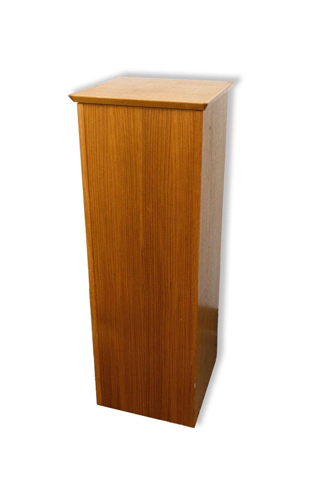 Elevate your cherished art pieces or collectibles with the Teak Display Pedestal Stand, a quintessential example of Danish Modern design. Crafted to perfection, this pedestal stand effortlessly marries functionality with aesthetic appeal. The rich,
