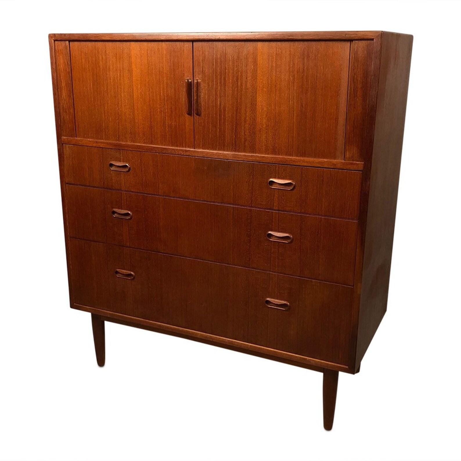 Mid-Century Modern danish teak dresser with tambour sliding doors with three drawers Dimensions: W39 x D18 x 45 inches.