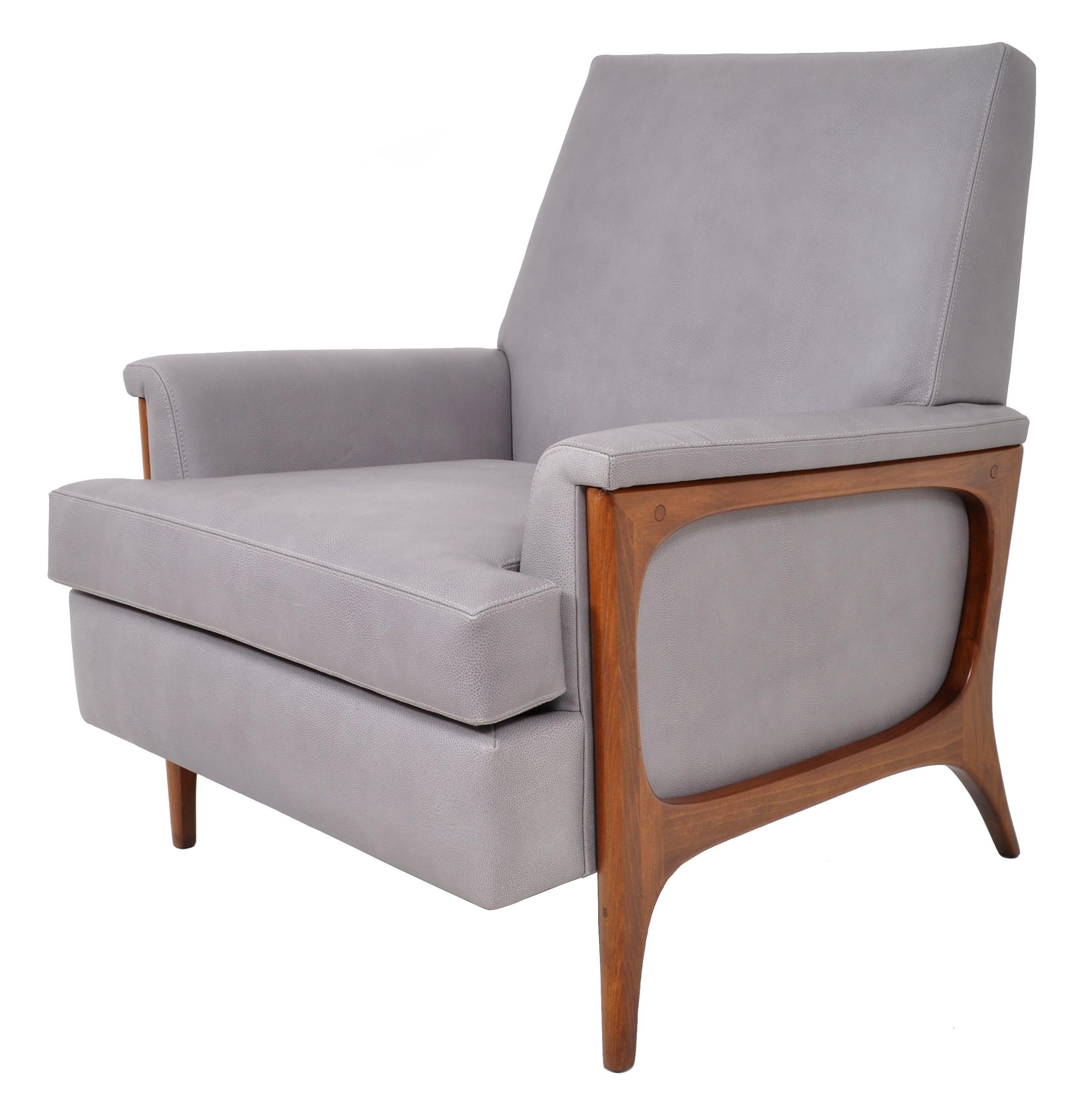 Original, 1960s Mid-Century Modern Danish teak leather armchair, circa 1960. The armchair has just been professionally re-upholstered in a very high quality greyish-blue Italian leather. The chair having a gentle slope and the sides made of a