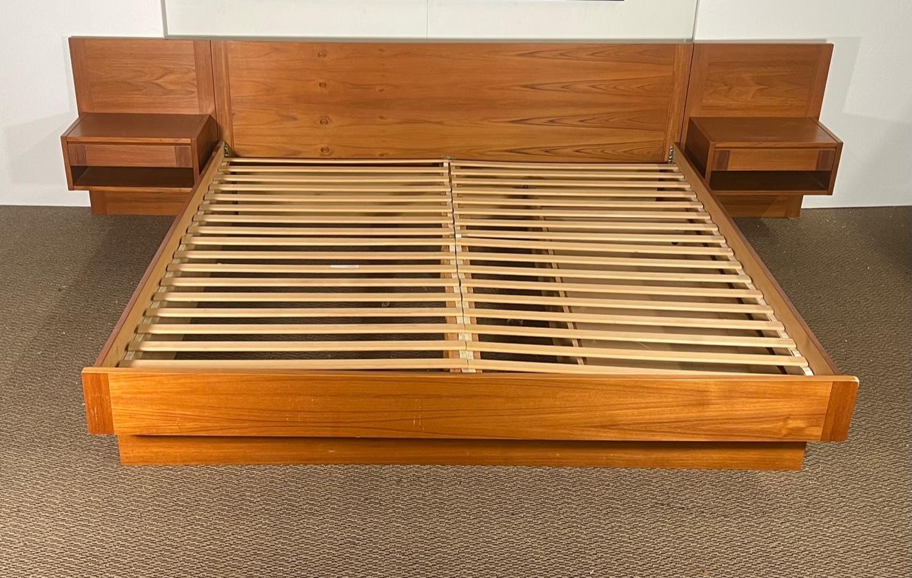 Fantastic mid century modern king size platform bed made in Denmark. Fits king size mattress. Teak veneer. Under bed storage drawer on the right side. The drawer is on small wheels for easy movement. Easy assembly.

Very good condition over all. A