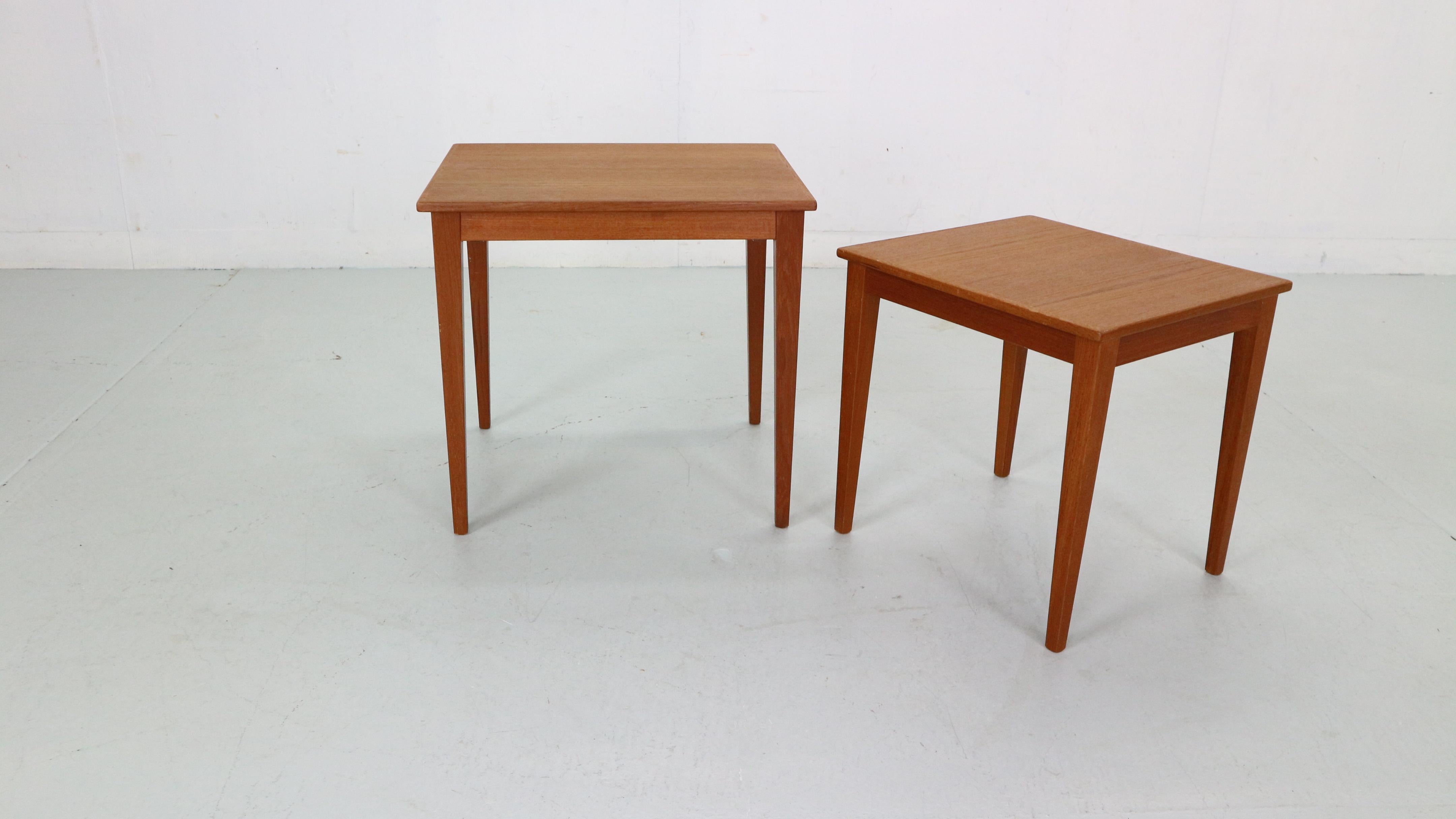 Mid-Century Modern period set of two nesting tables made in 1960s period, Denmark.
Minimalistic and elegant Danish design tables are made from teak wood.
The two tables stackable under each other. The feet can be easily unscrewed.
Beautiful