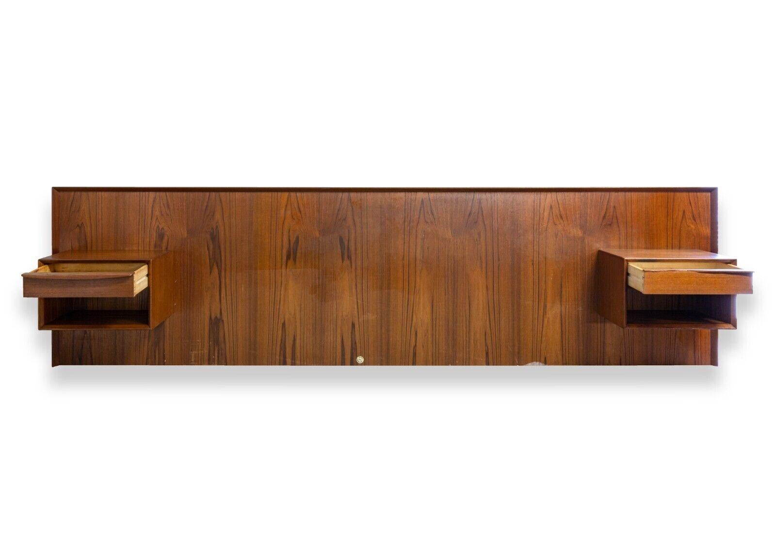 A mid century modern Danish teak queen headboard with floating nightstands. This beautifully crafted headboard is from Danish brand Falster. This piece is made from a gorgeous teak wood with a very detailed wood grain, featuring two floating
