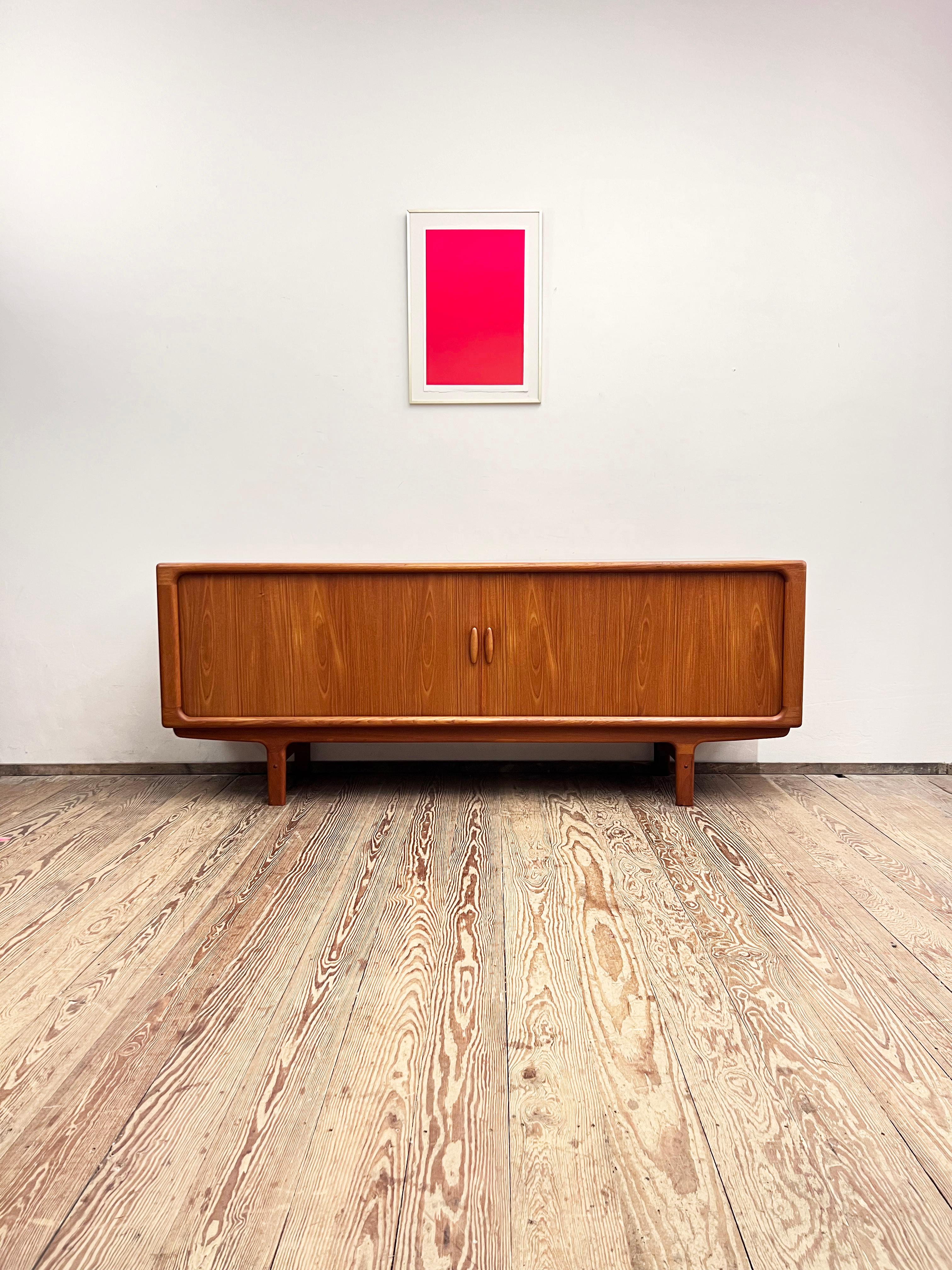 Dimensions: 220x53x86 cm (Width x Depth x Height)

This Scandinavian design sideboard or TV console was manufactured in the 1960s by Danish premium manufacturer Dylund in Denmark.

The mid-century Credenza showcases exquisite Danish design and