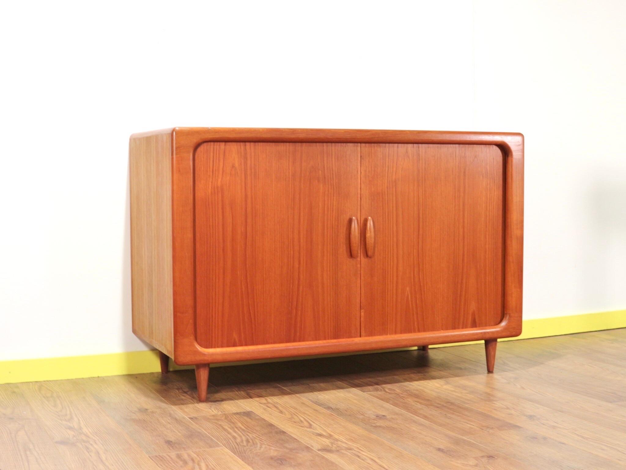 This gorgeous cabinet made by Danish furniture maker Dyrlund is a truly stunning piece. With its tambour doors and striking design it is a true statement piece. The slide out drawers for vinyl make this truly stand out from the crowd.