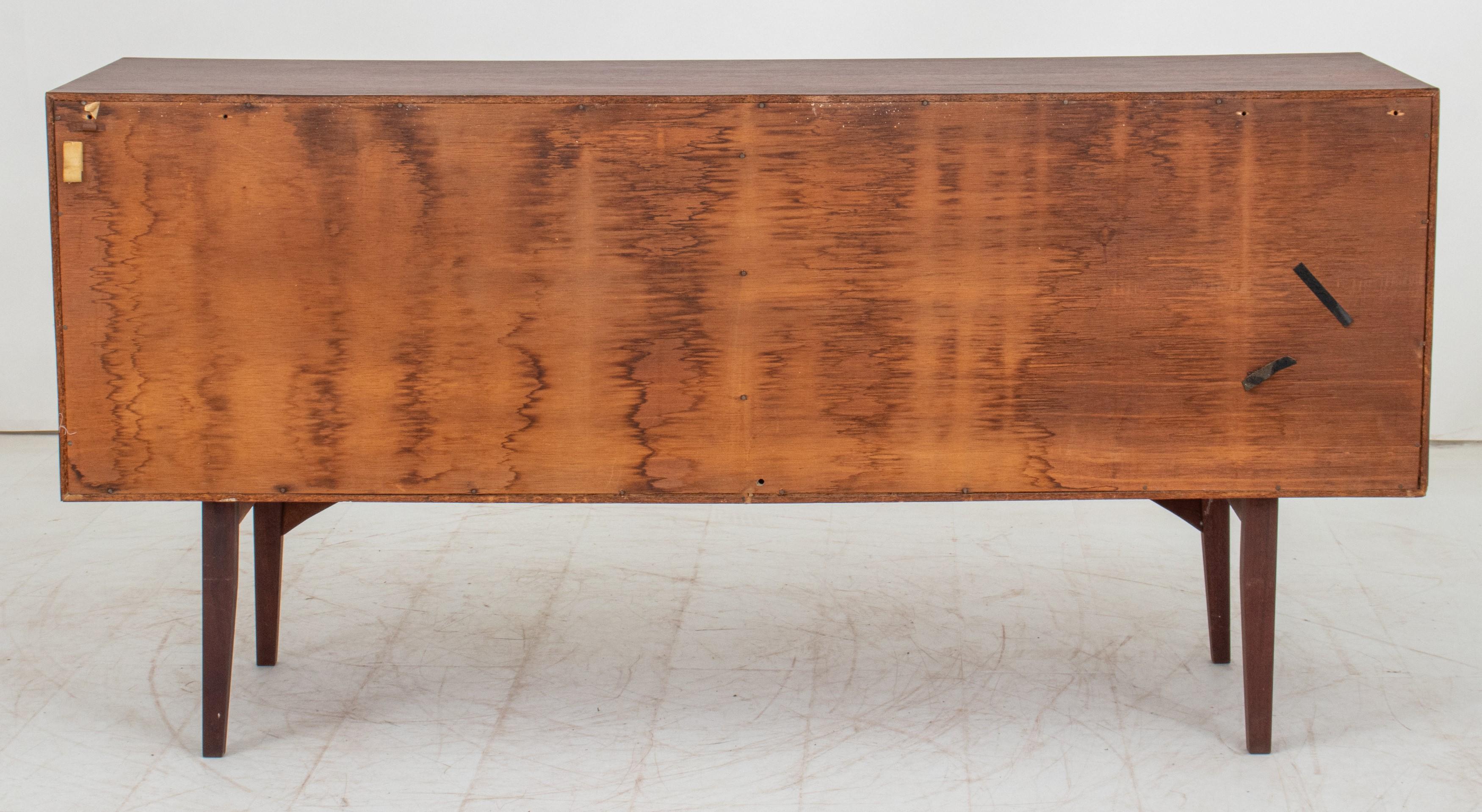 Mid-Century Modern Danish Teakwood Credenza. Here's the information:

Style: Mid-Century Modern (MCM)
Material: Teakwood
Features:
Two sliding doors
Four tapered legs
Apparently unmarked, which is not uncommon for some vintage