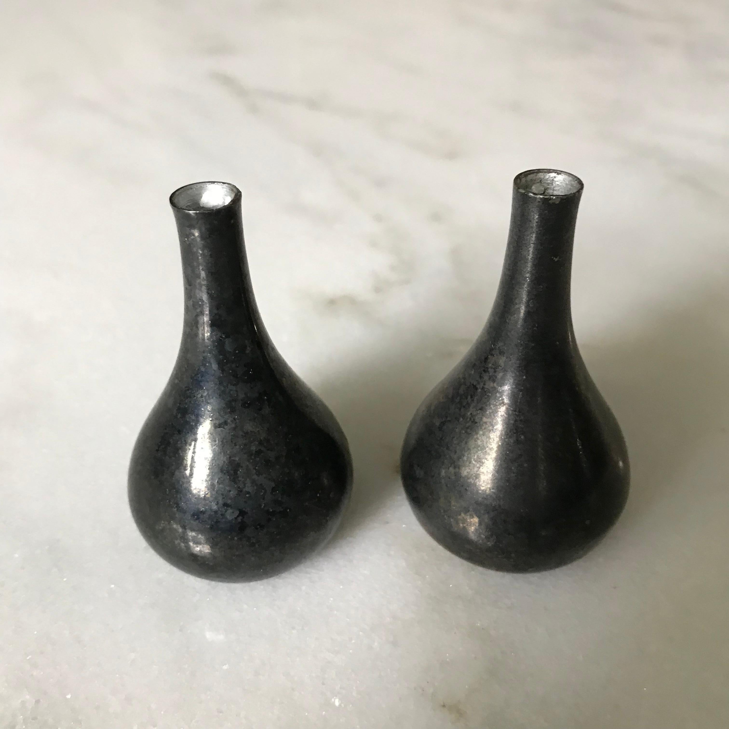 Remarkably designed Teardrop shape candleholders by Dansk Designs France IHQ. Designed to either tilt or stand straight, these Silver-plated weighted marvels are a spectacular representation of the Mid Century Modern era. Marked.